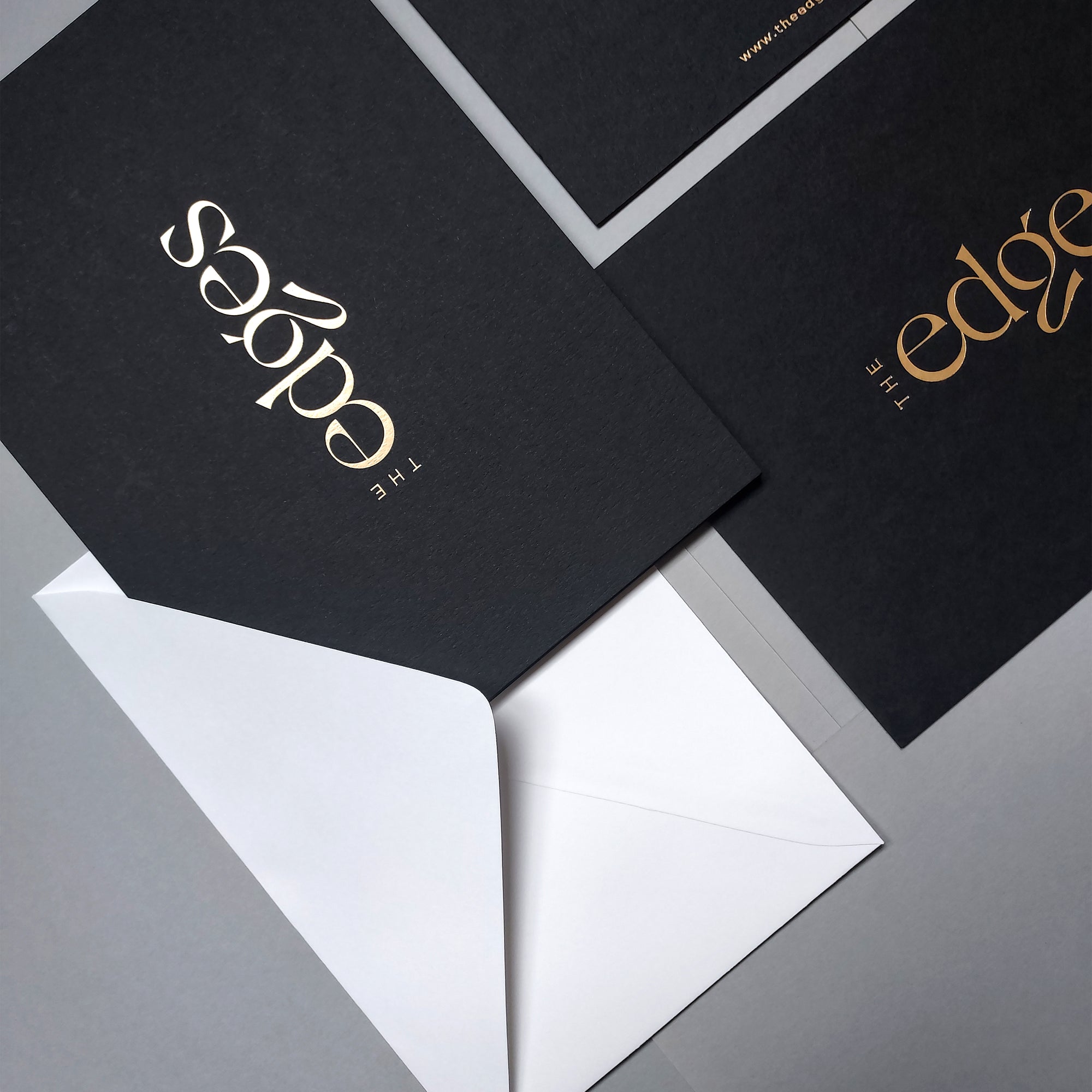 Elegant black 4x6 postcards with foil and white envelope