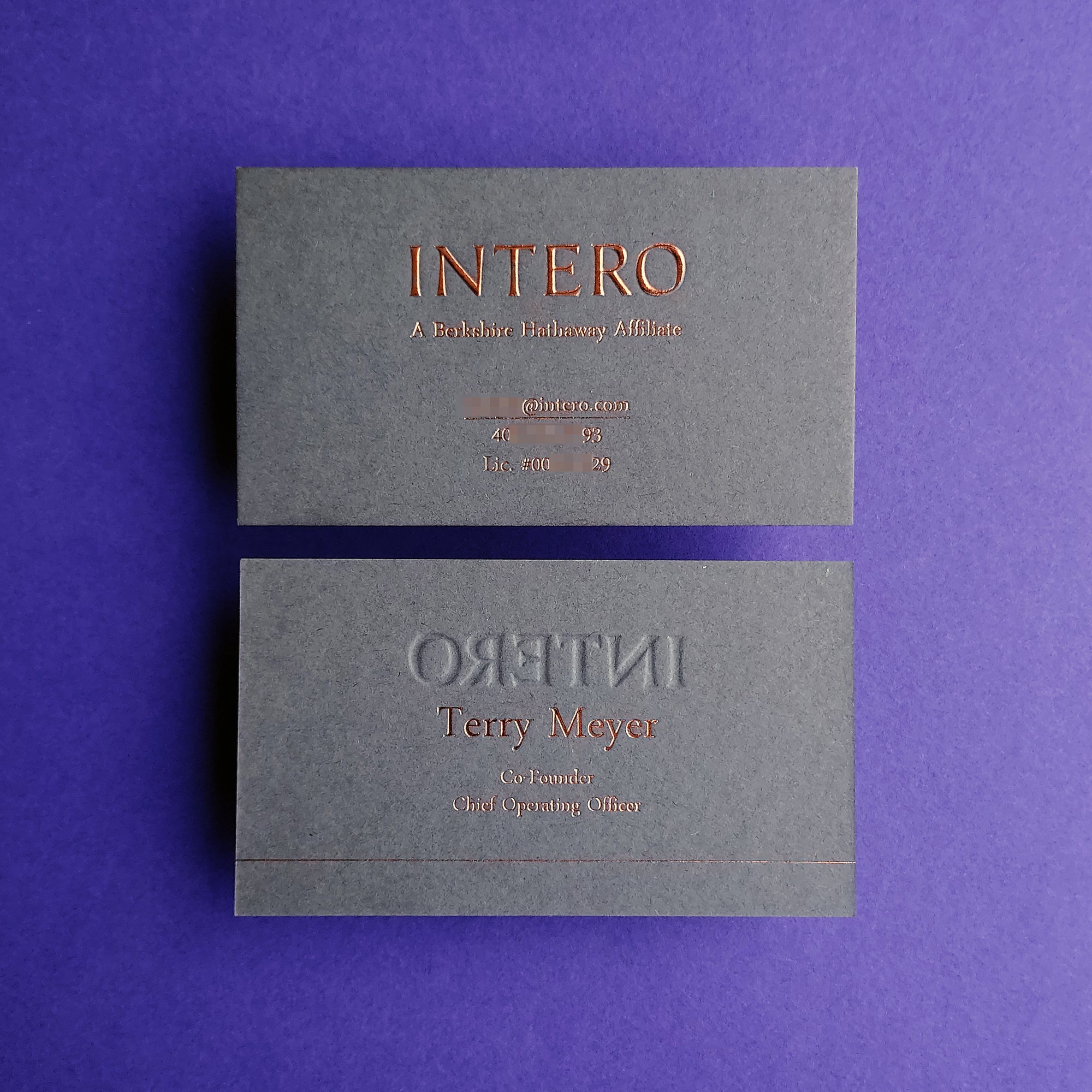 Handcrafted dark grey business card featuring deep emboss and fast shipping.