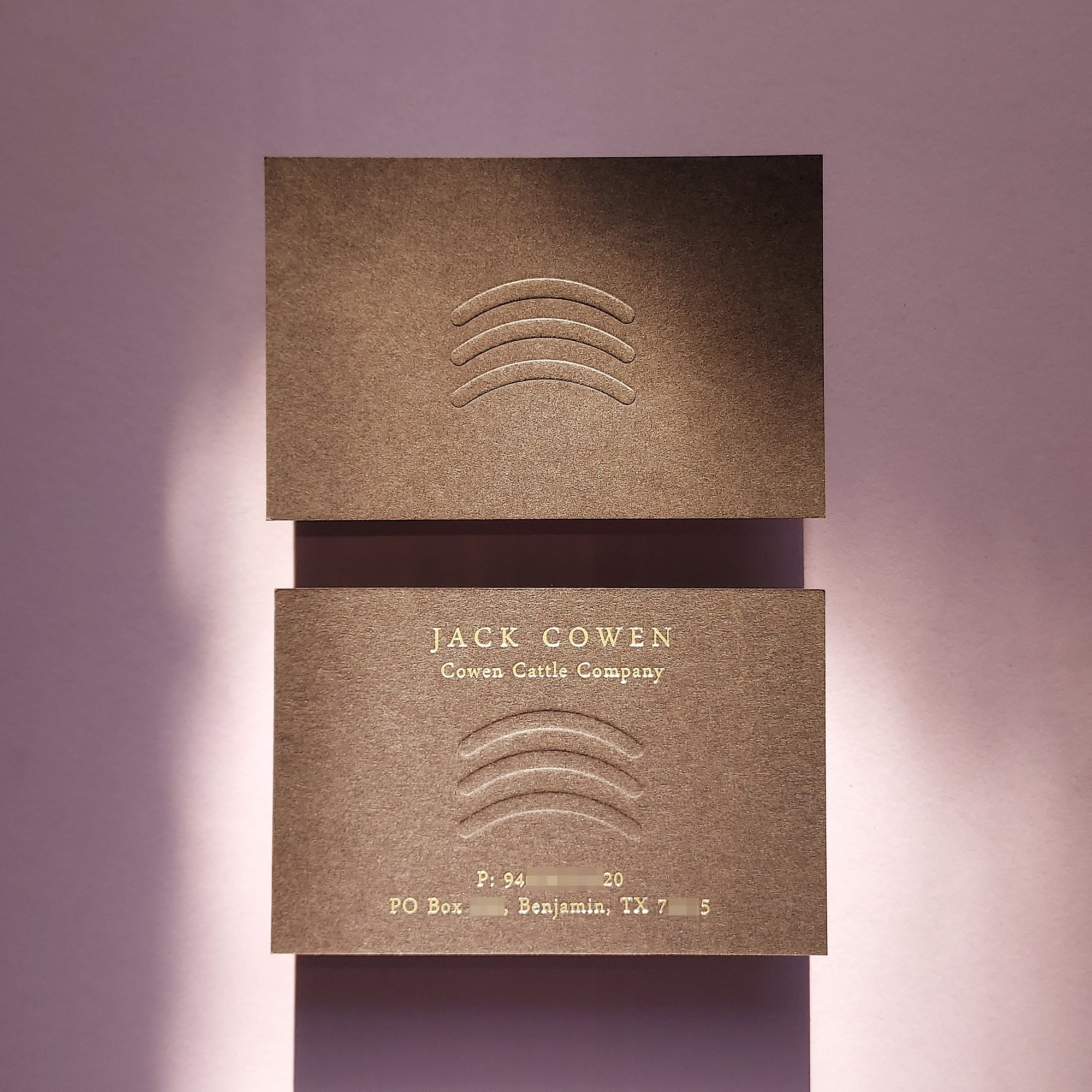 Elegant brown business card with custom emboss and fast shipping for creatives.