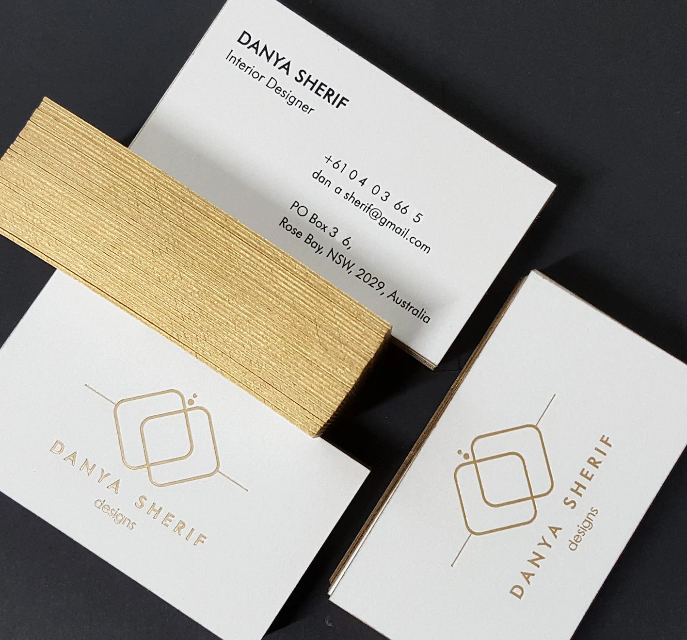 Elegant foil-stamped cotton card with shimmering gold edge painting.