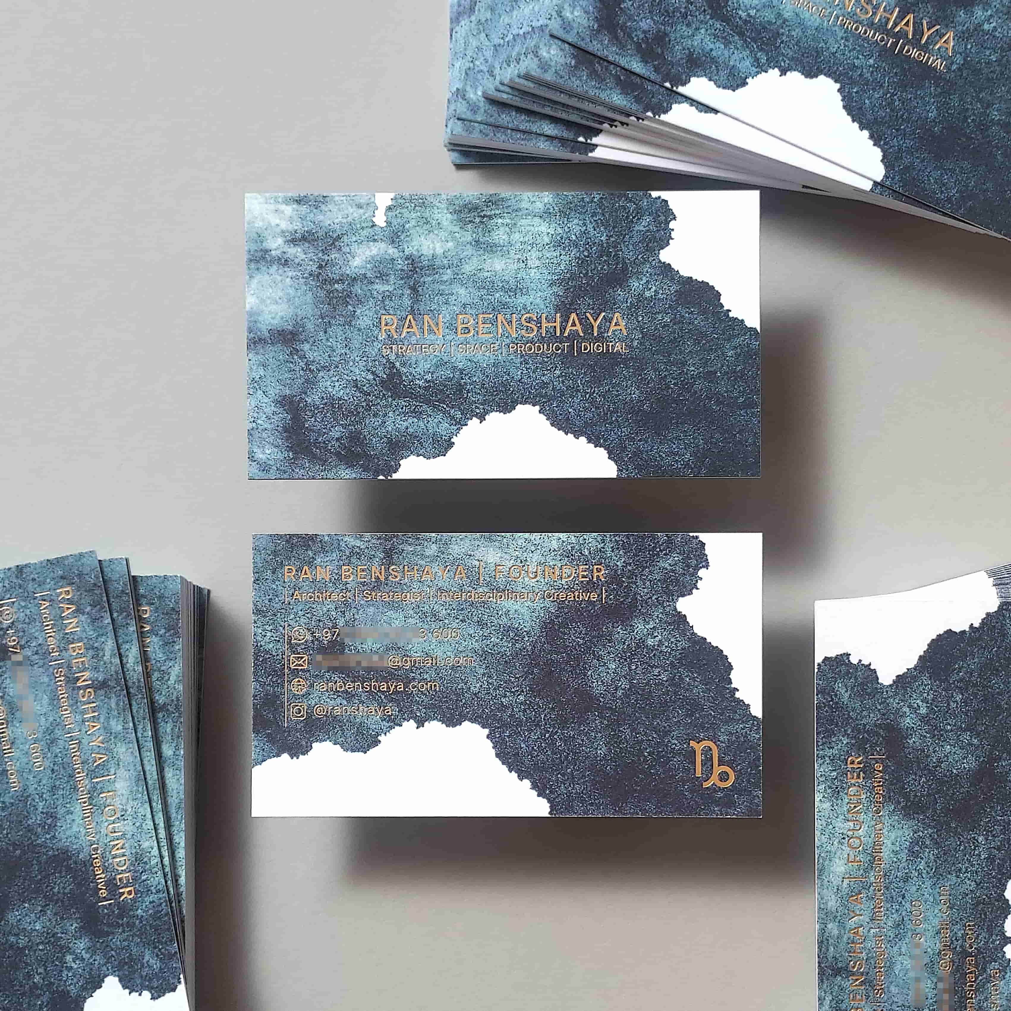 Shimmering 400gsm full-color business card by OddPlanPrint, with double-sided gold foil.