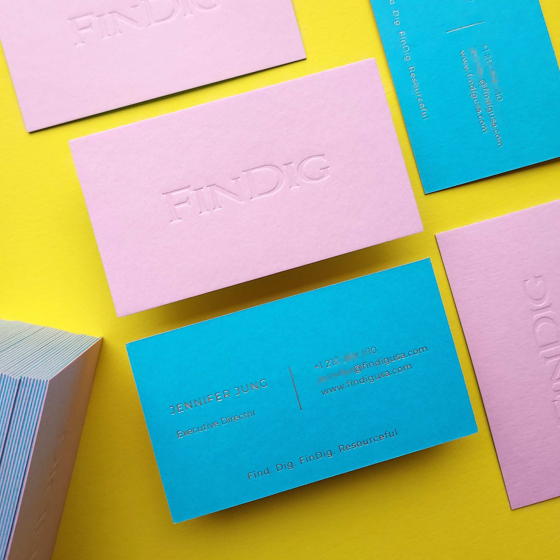 Custom pink card with deep blind deboss for strong presence.