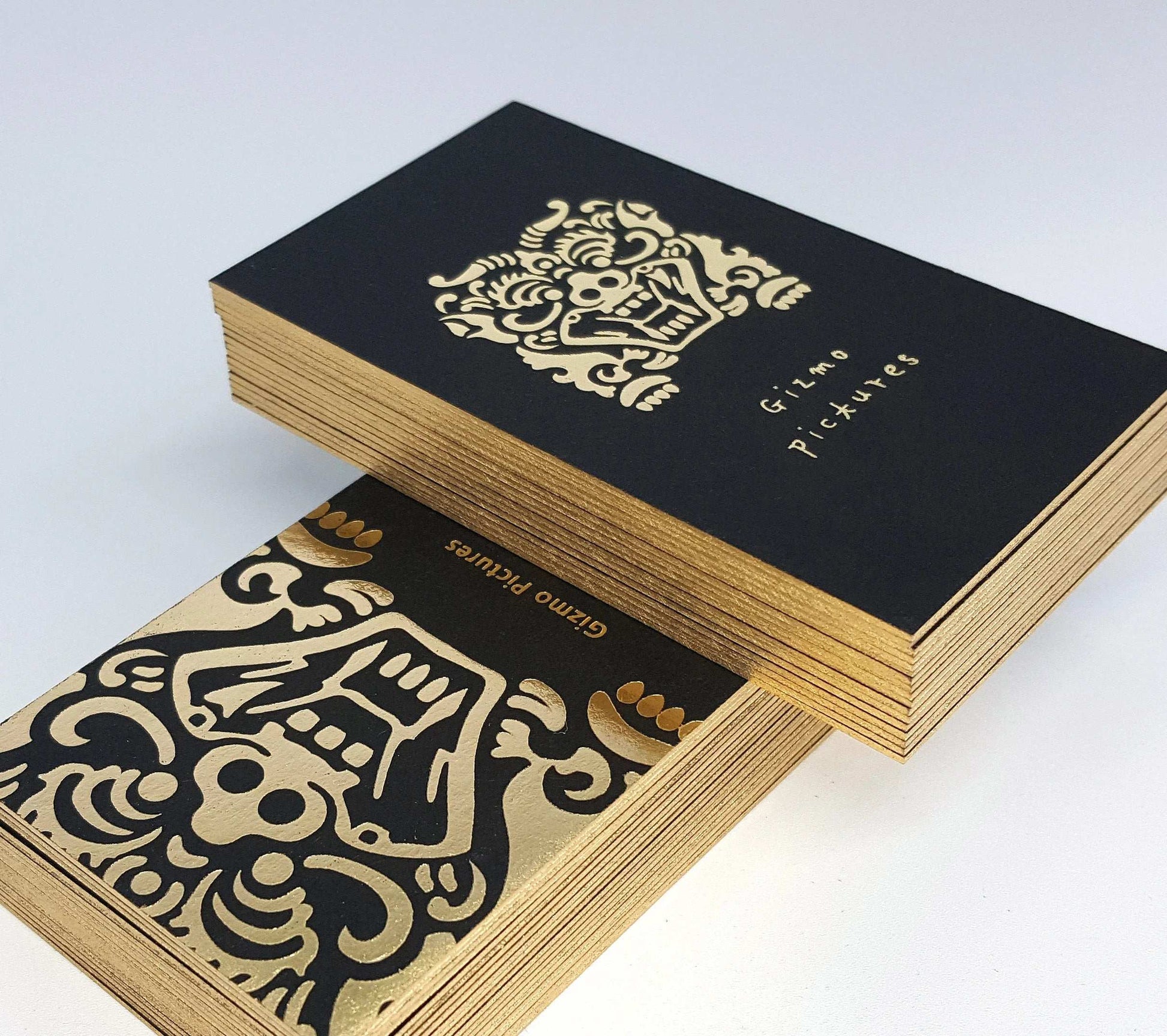 Gold-painted edge black card crafted by hand for a bold, elegant look.