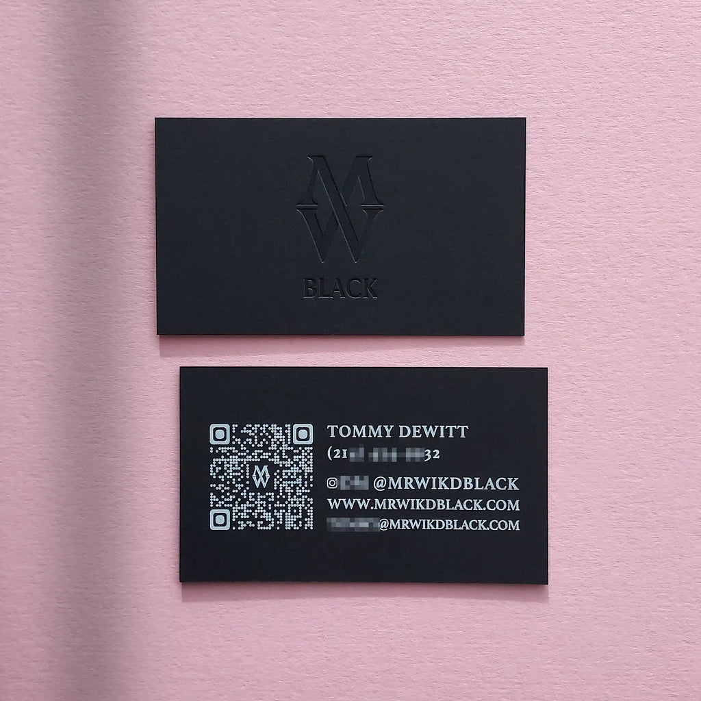 Black debossed business cards 38pt with deboss and white foil made by OddPlanPrint.