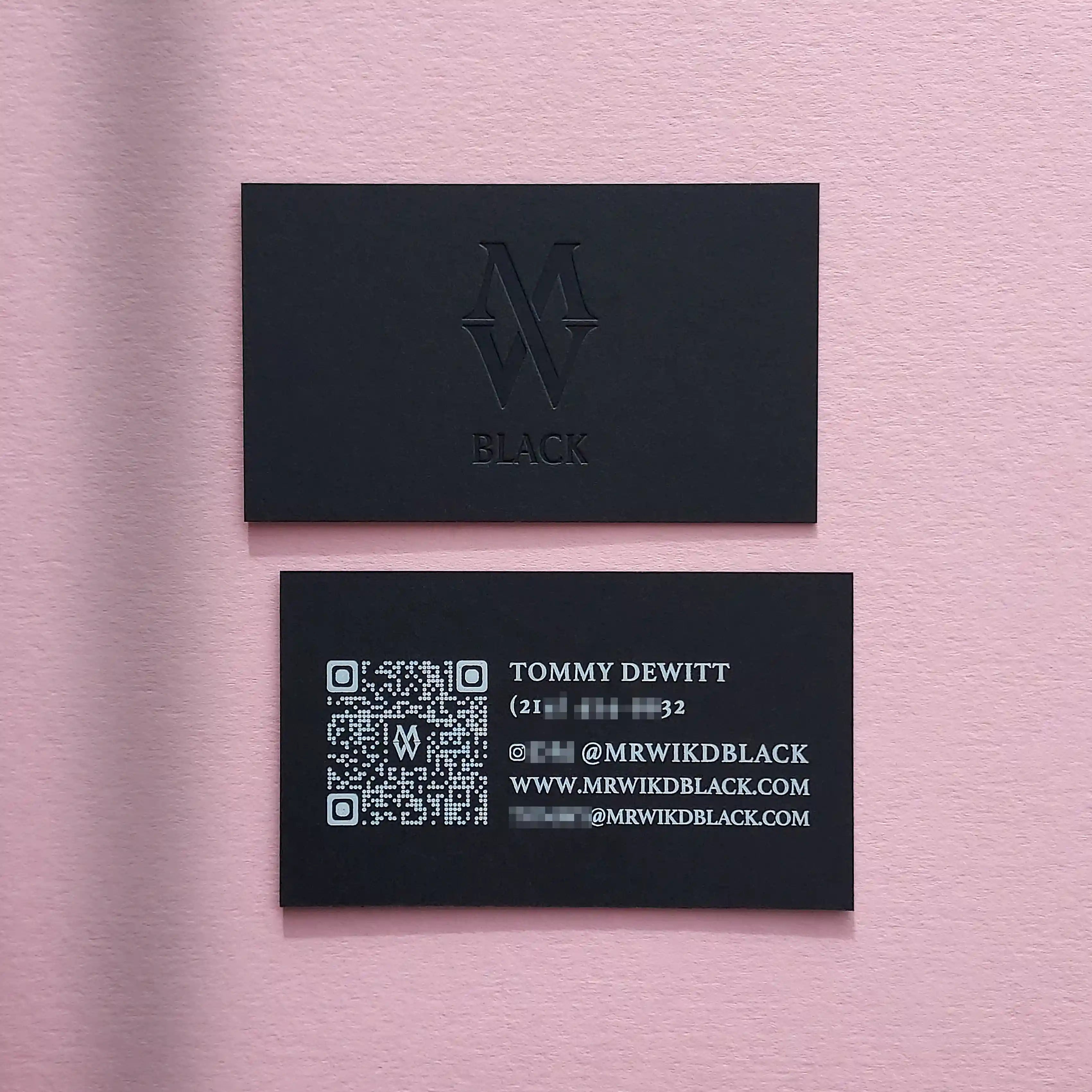 Black debossed business cards 38pt with deboss and white foil made by OddPlanPrint.