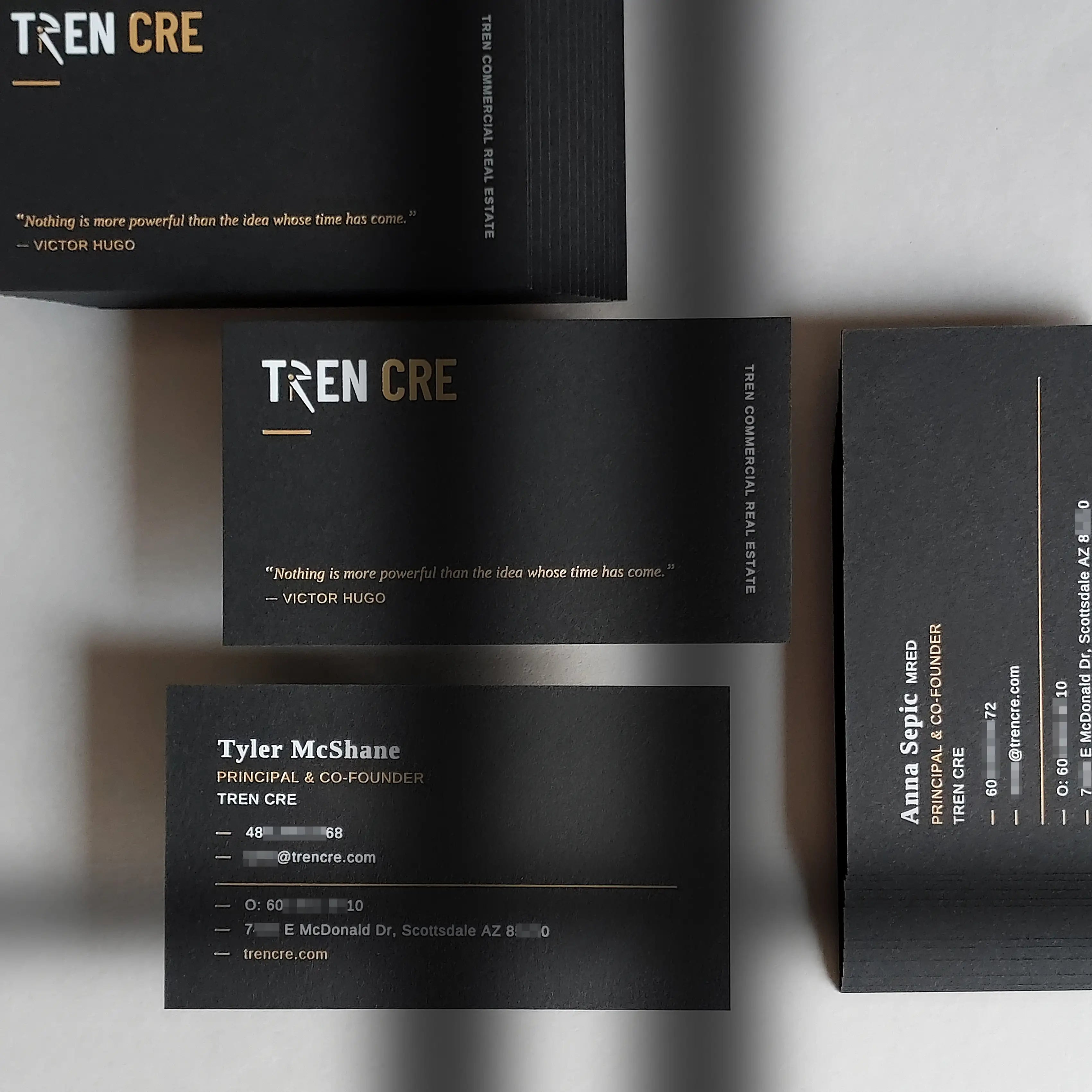 Premium black business cards by OddPlanPrint featuring double-sided gold foil and white foil stamping on heavy 38pt(700gsm) stock.