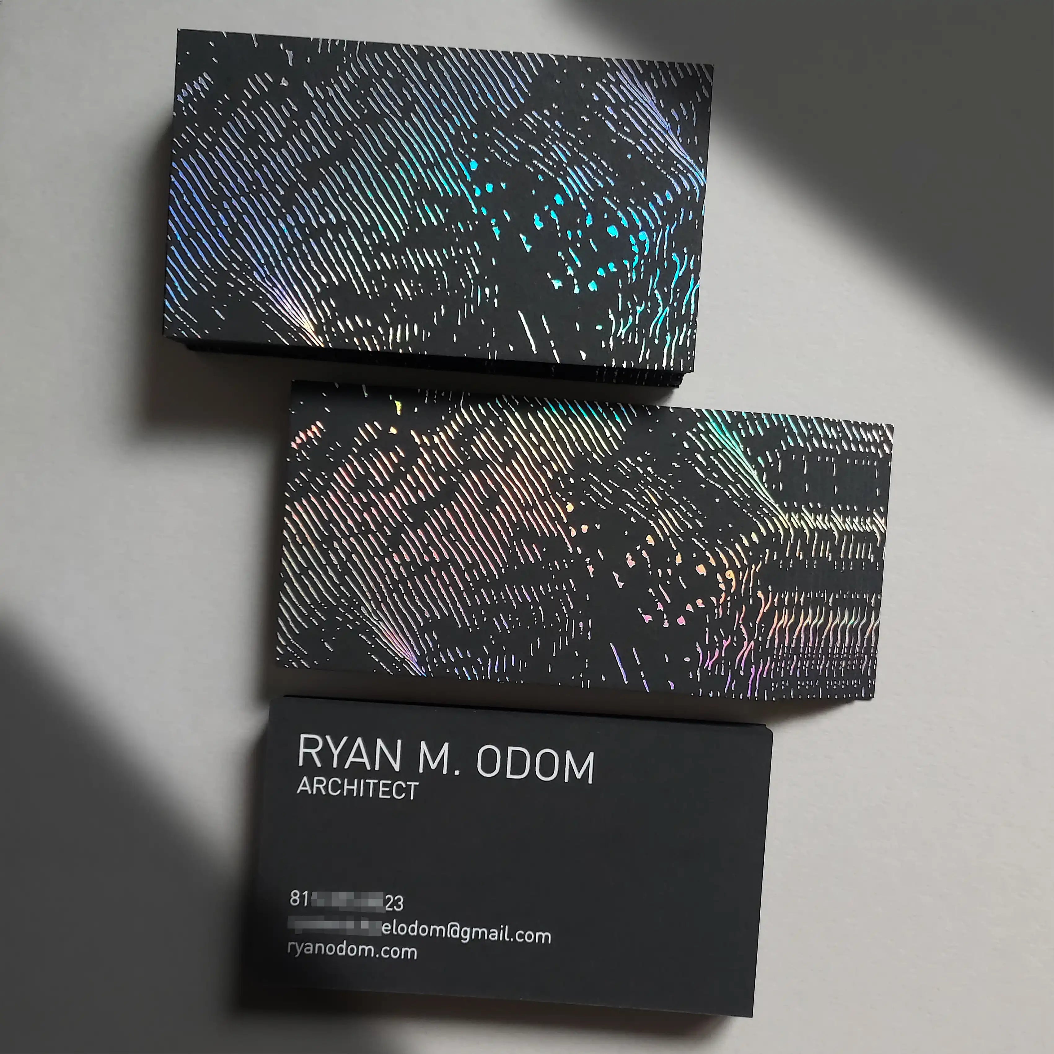 38pt black business card full view with hologram foil highlights and white foil typography for clear contact details - OddPlanPrint