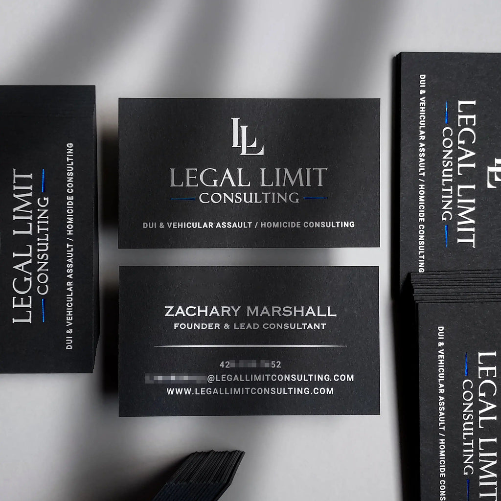 Luxury 38pt black business card by OddPlanPrint, featuring silver matte, blue glossy, and white foil.