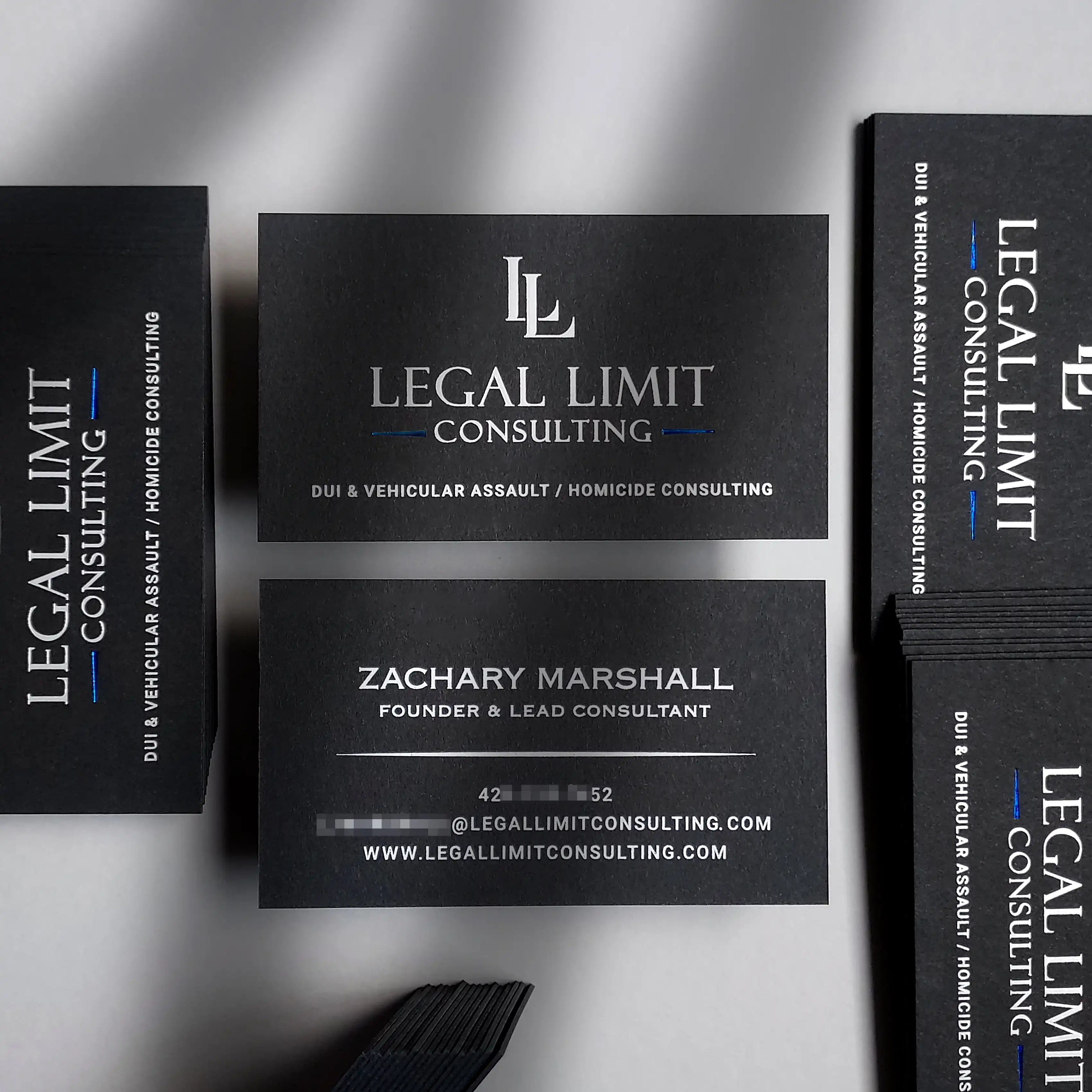 Luxury 38pt black business card by OddPlanPrint, featuring silver matte, blue glossy, and white foil.