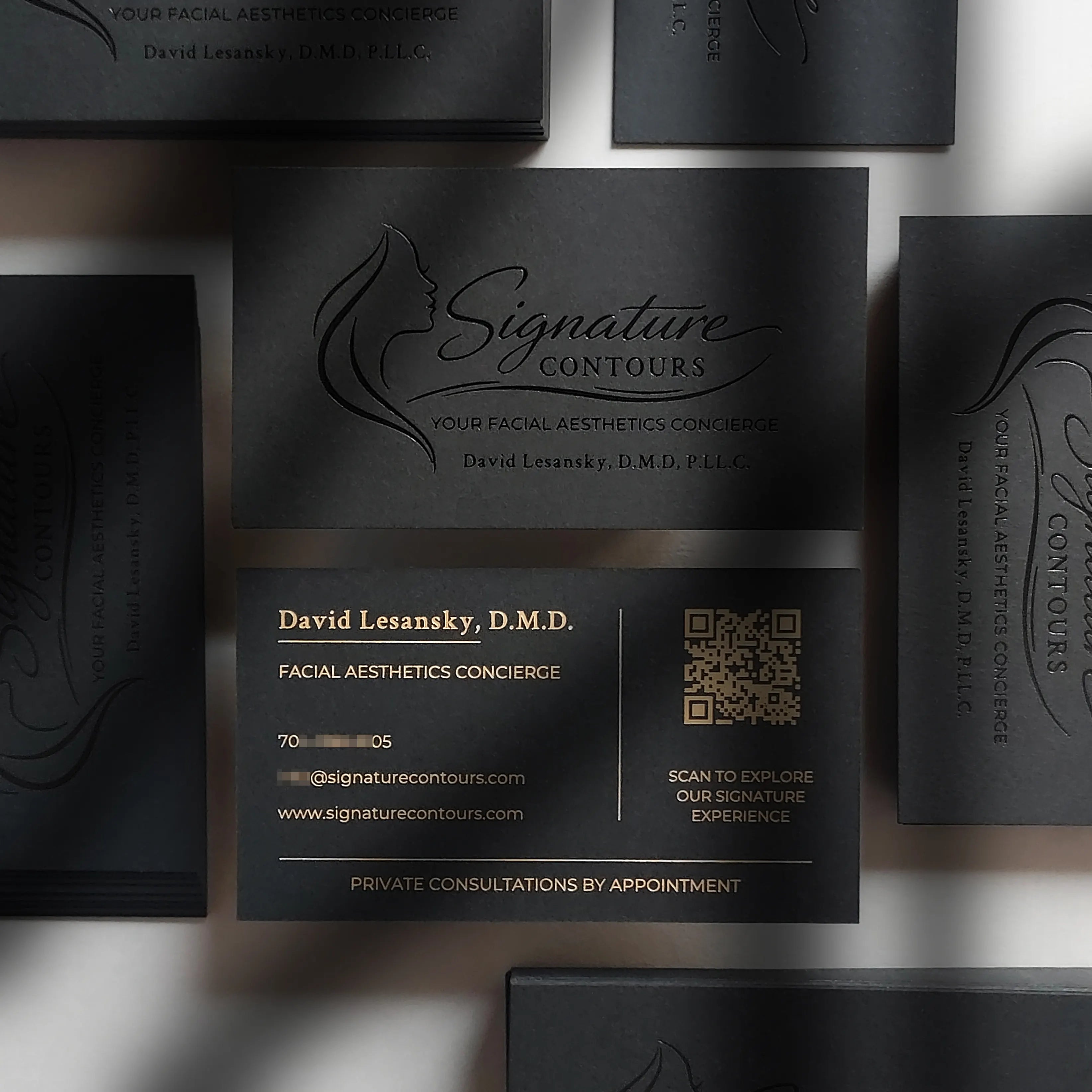 Black business cards 38pt, 700gsm with glossy black foil and matte gold foil produced by OddPlanPrint.