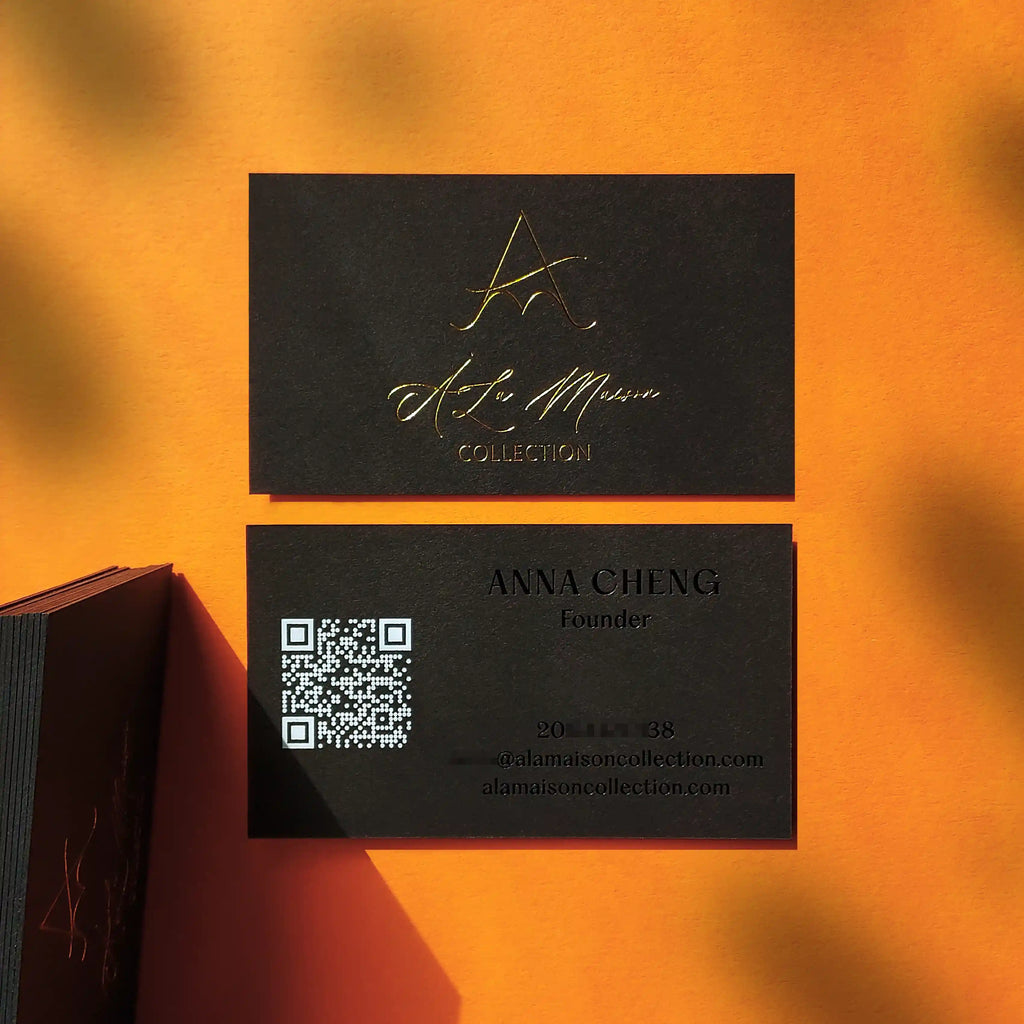 Black 38pt business cards with glossy gold, black and white foil by OddPlanPrint.