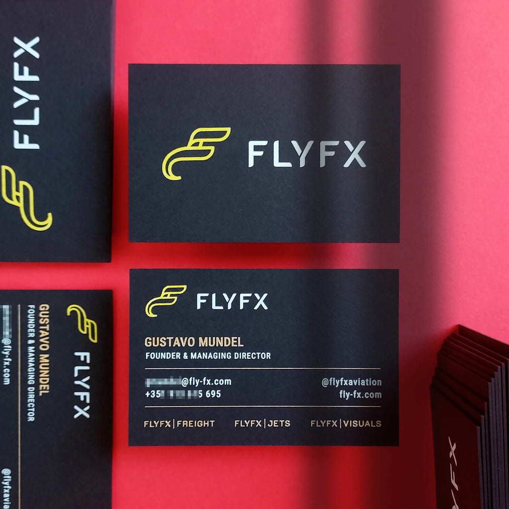 Luxury black business cards featuring yellow, gold and white foil details in 700gsm thickness by OddPlanPrint.