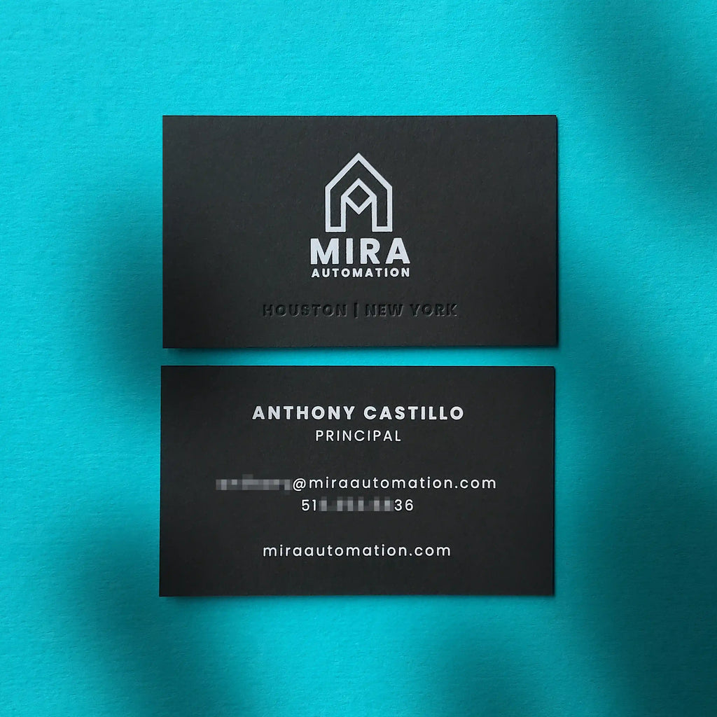 Thick 38pt black business cards, debossed and white foil by OddPlanPrint.