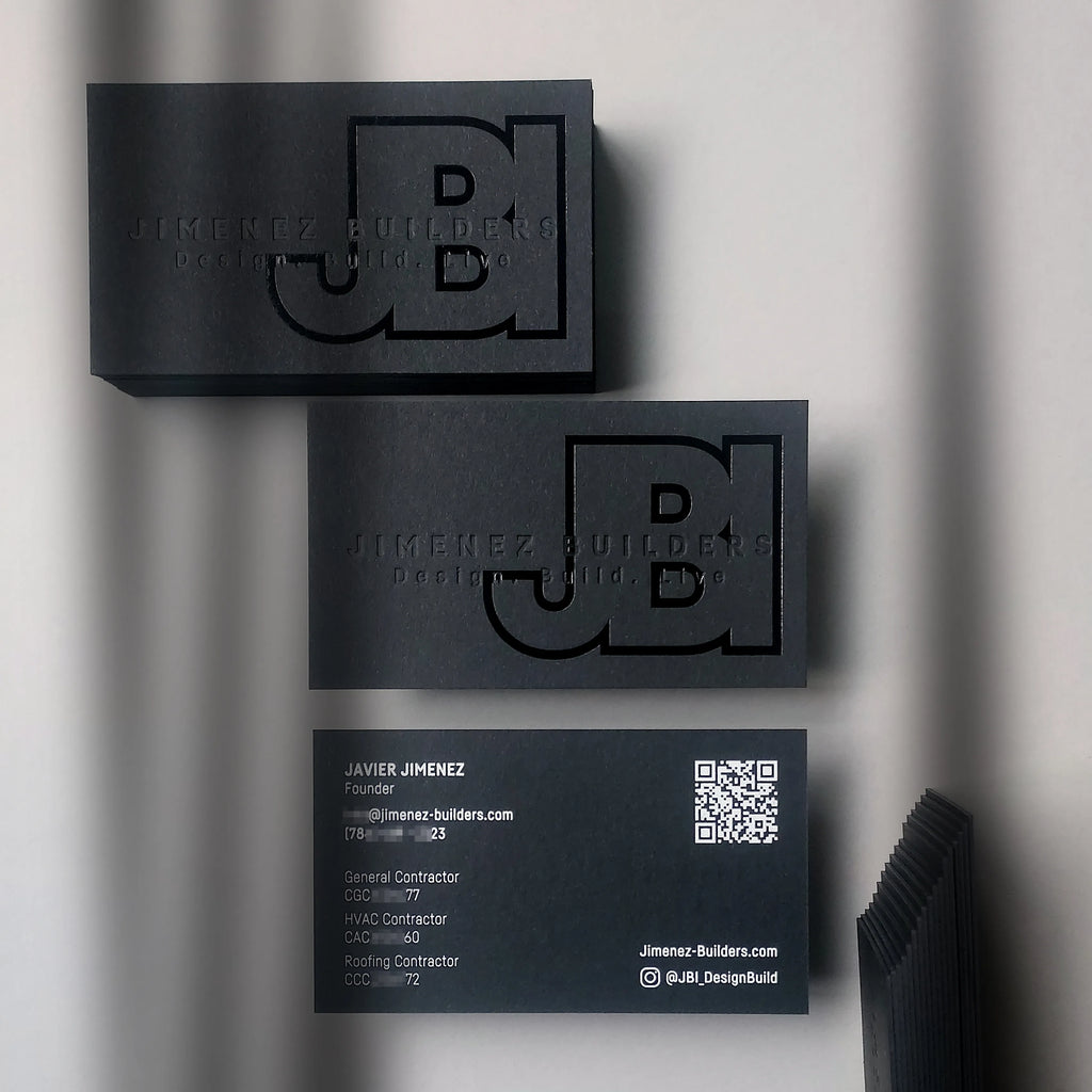Premium 38pt black business card showing black foil and deboss front and white foil back by OddPlanPrint