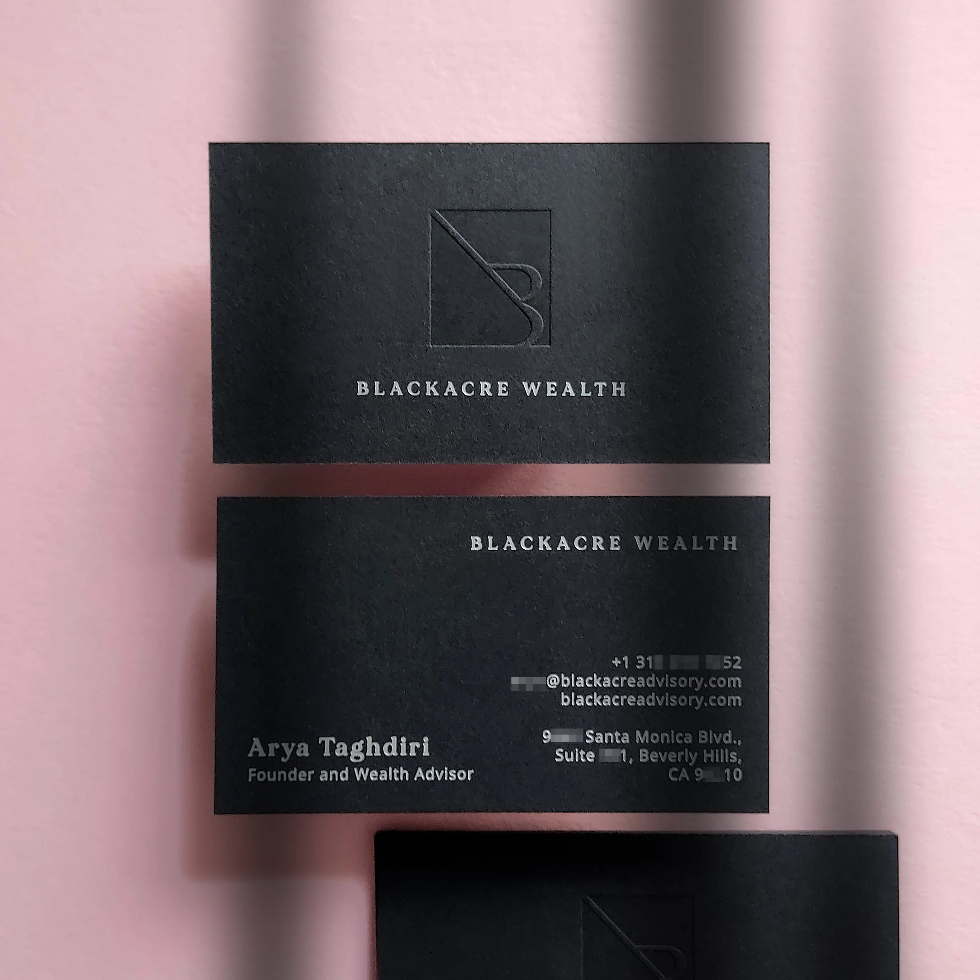 Premium 38pt black business cards by OddPlanPrint engineered with high-contrast matte silver foil stamping and deep debossed typography on 700gsm stock.