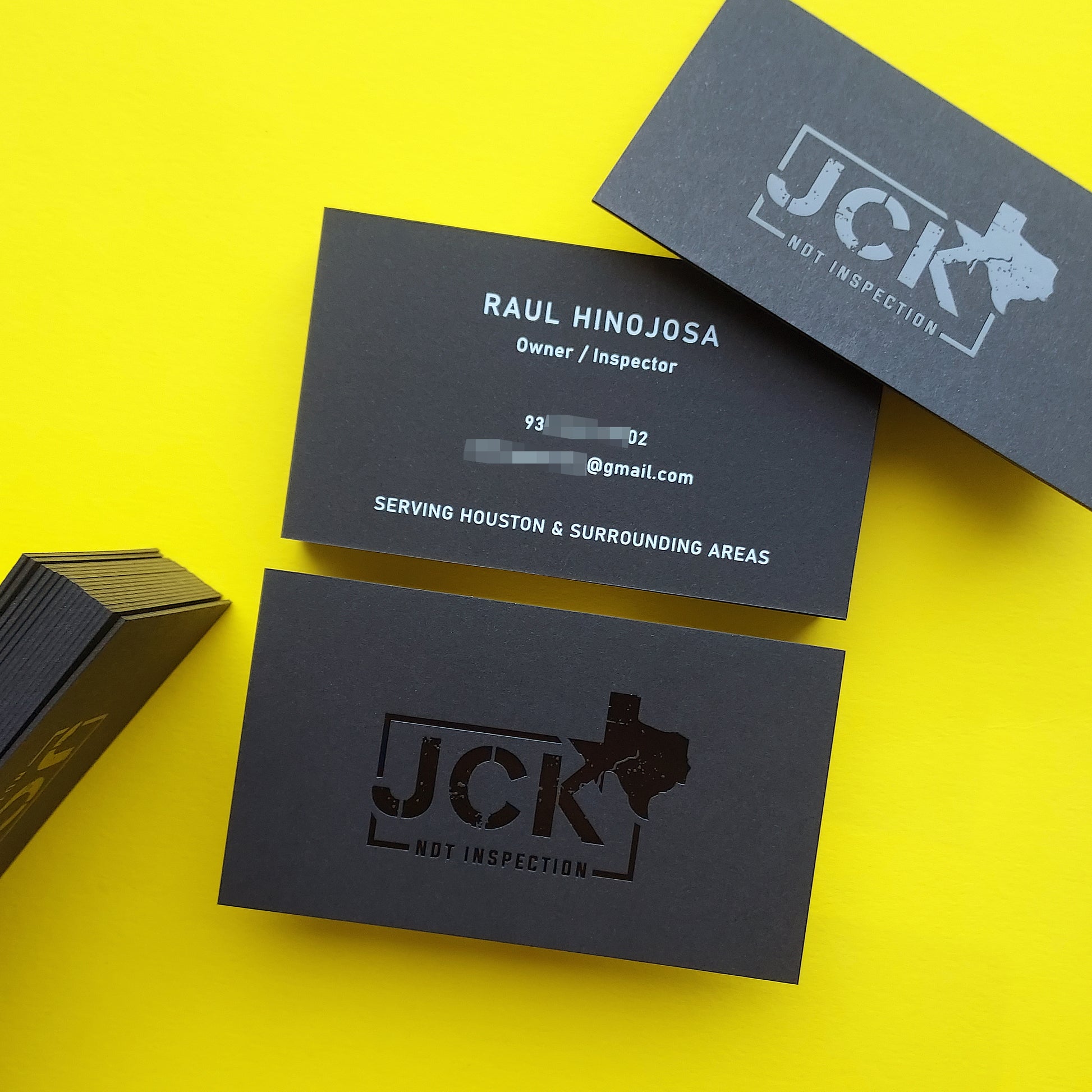 Heavy black card with blind deboss and embossed logo