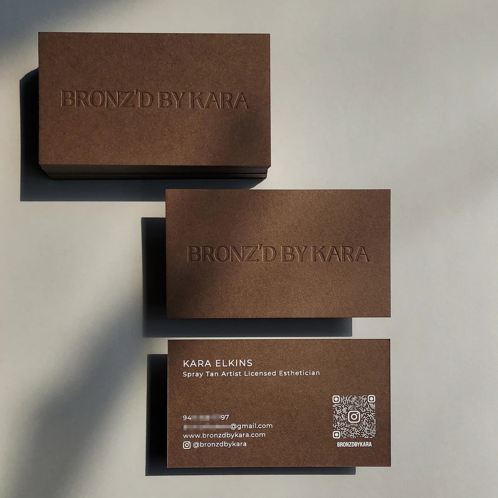 Brown business cards with blind deboss and white foil on 30pt 540gsm stock by OddPlanPrint