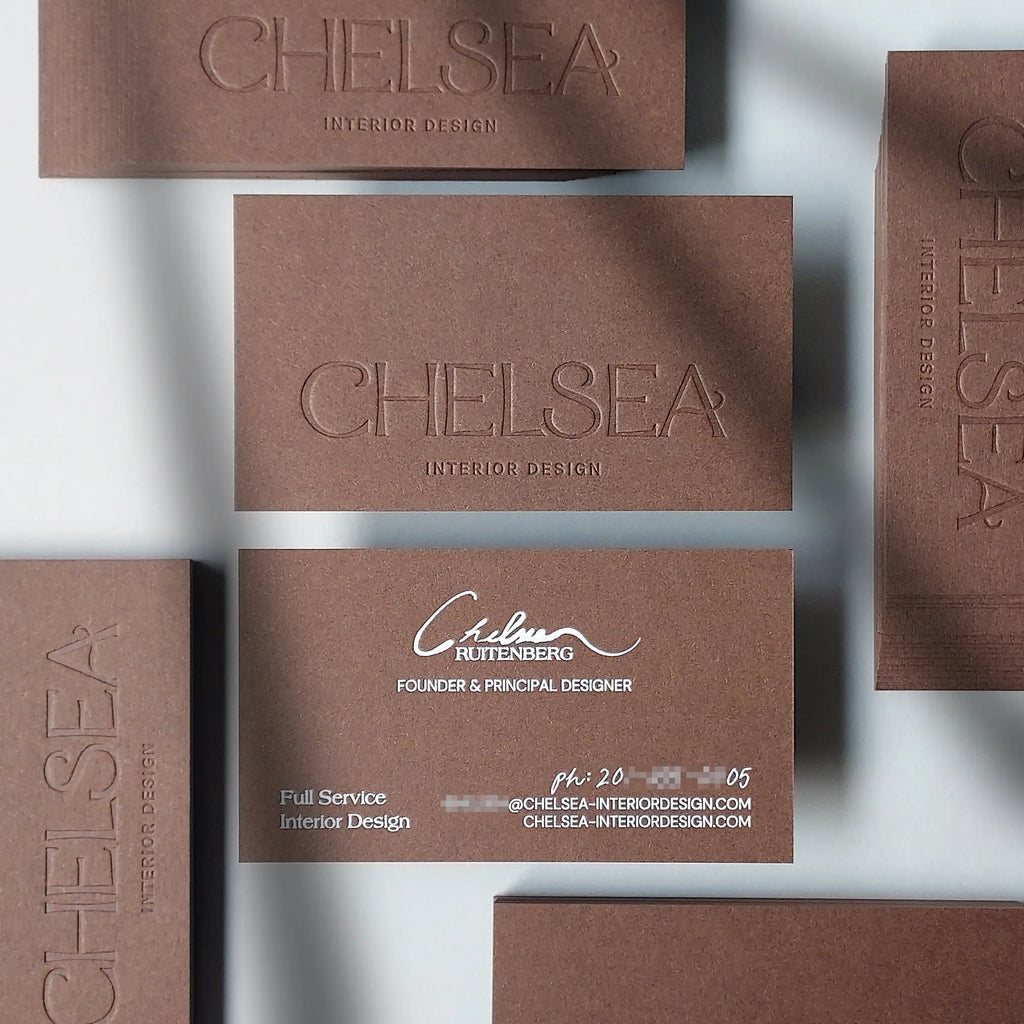 Luxury 30pt brown business card with deboss imprint and matte white foil lettering from OddPlanPrint.