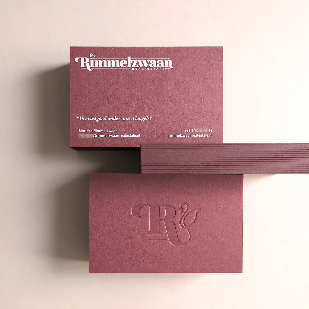 Refined 38pt 700gsm Claret business cards showing blind deboss depth and white printing from OddPlanPrint.