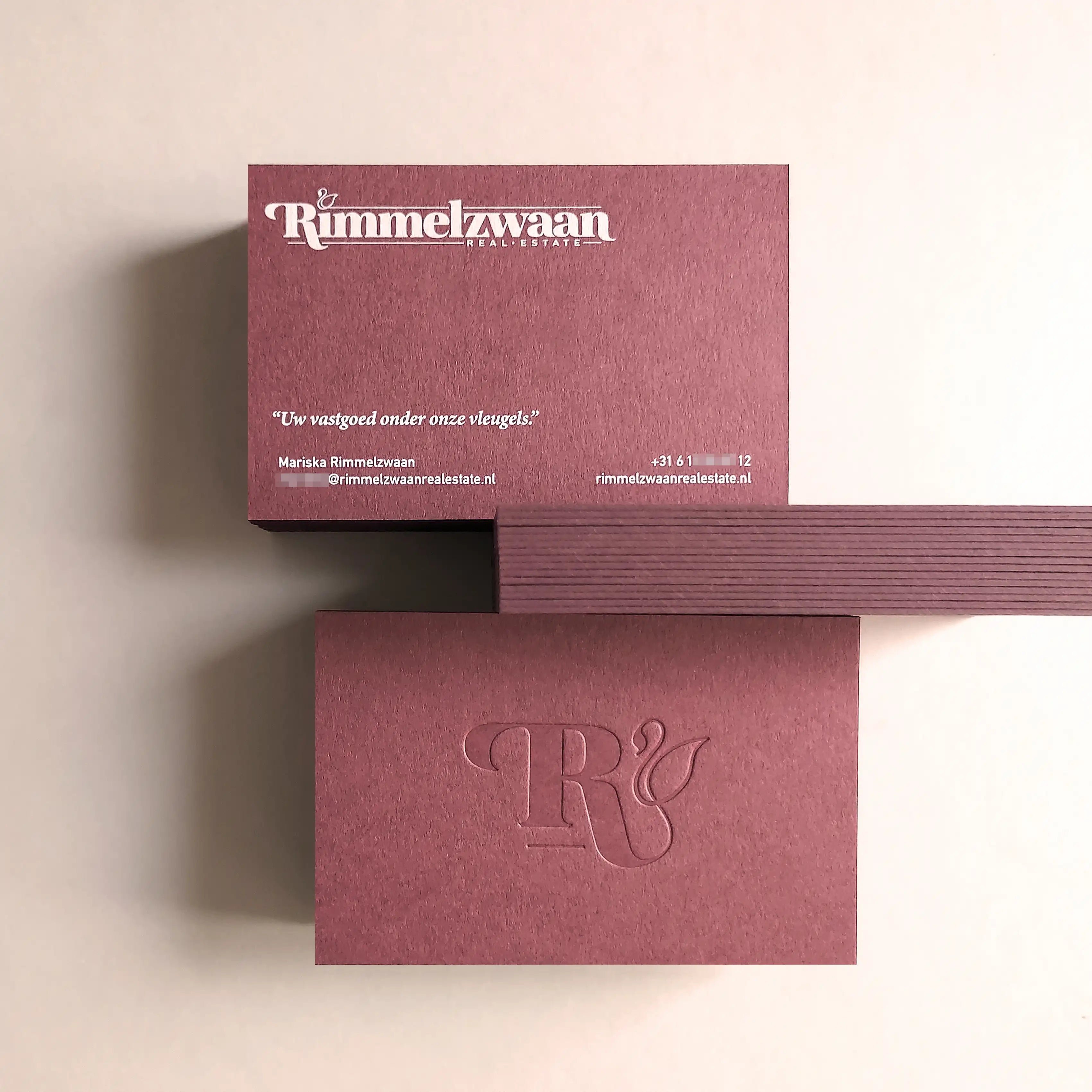 Refined 38pt 700gsm Claret business cards showing blind deboss depth and white printing from OddPlanPrint.