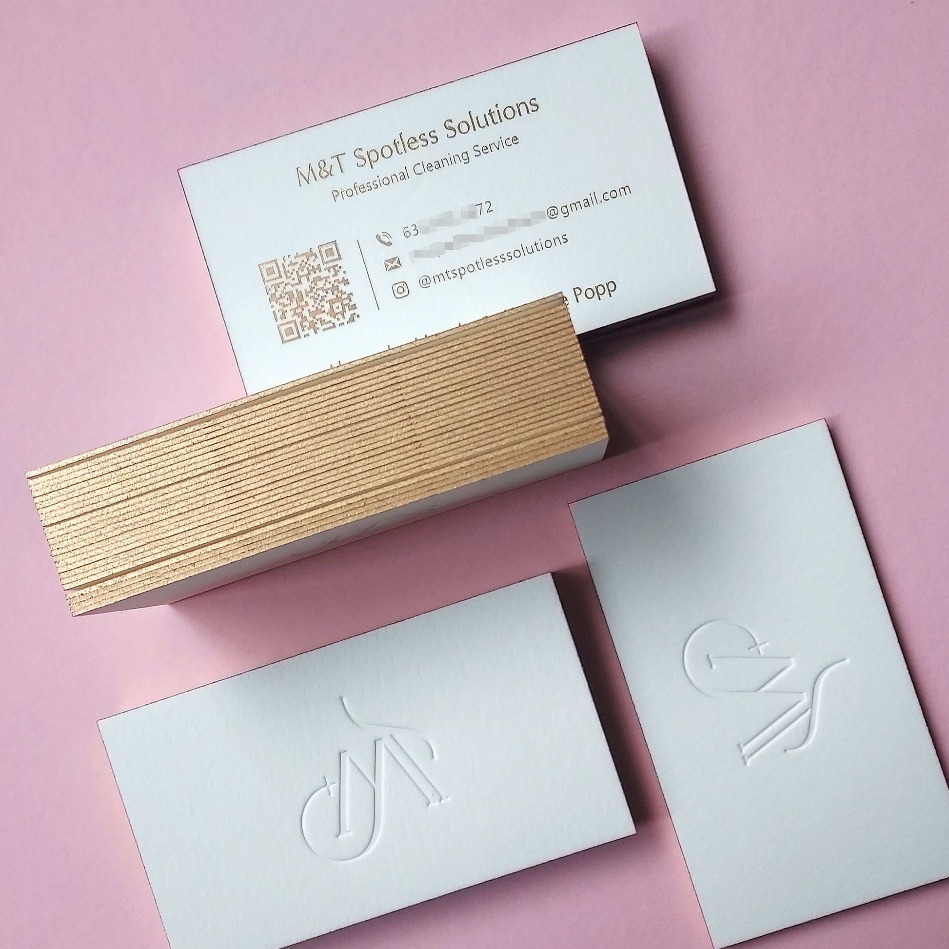 Gold-edged cotton card with custom deboss and foil accents.