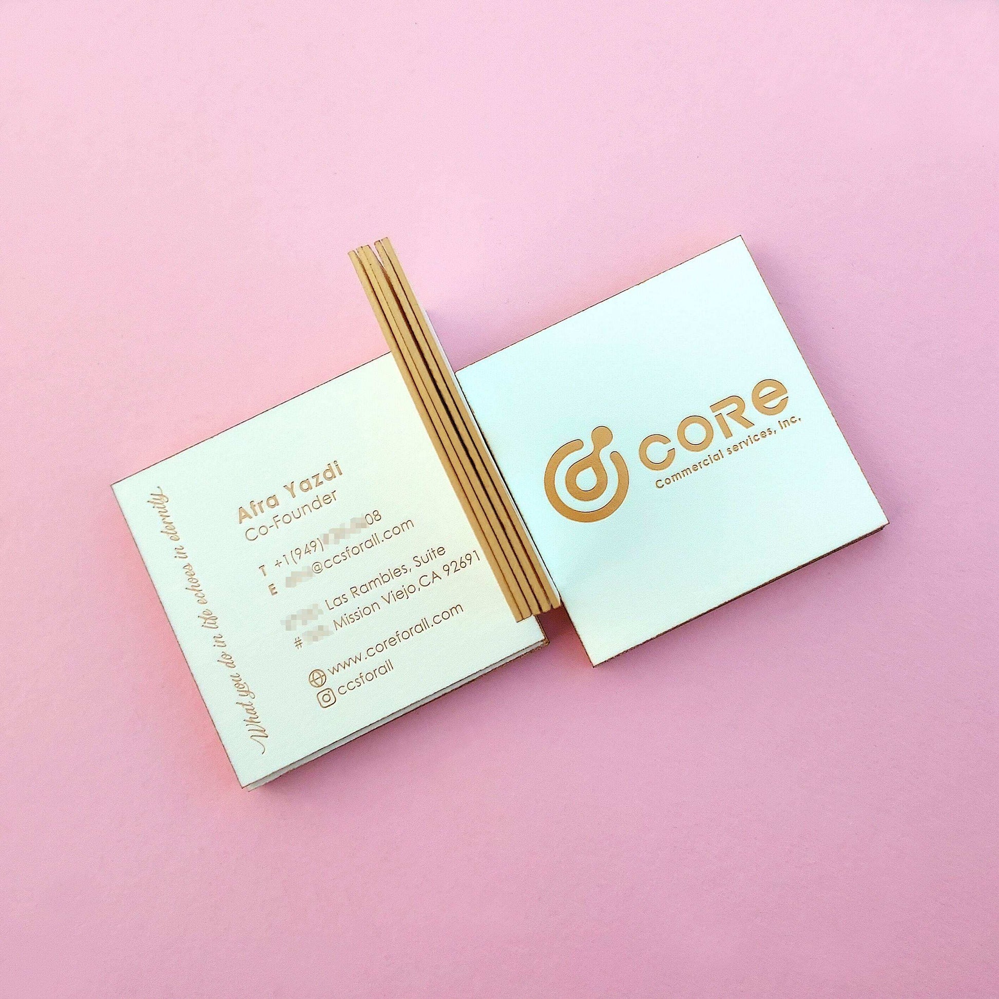 Luxurious cotton stock business card with gold side edges.