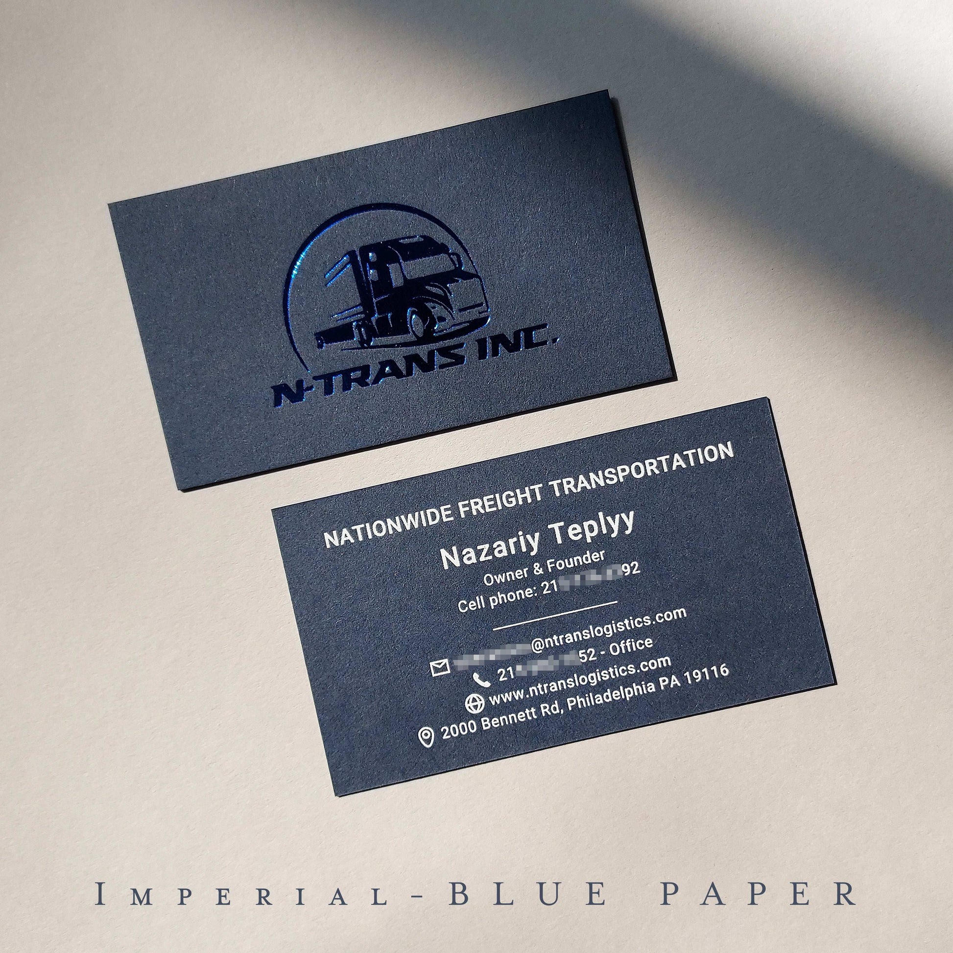 Striking blue letterpress card with foil and emboss, crafted for artists and startups.