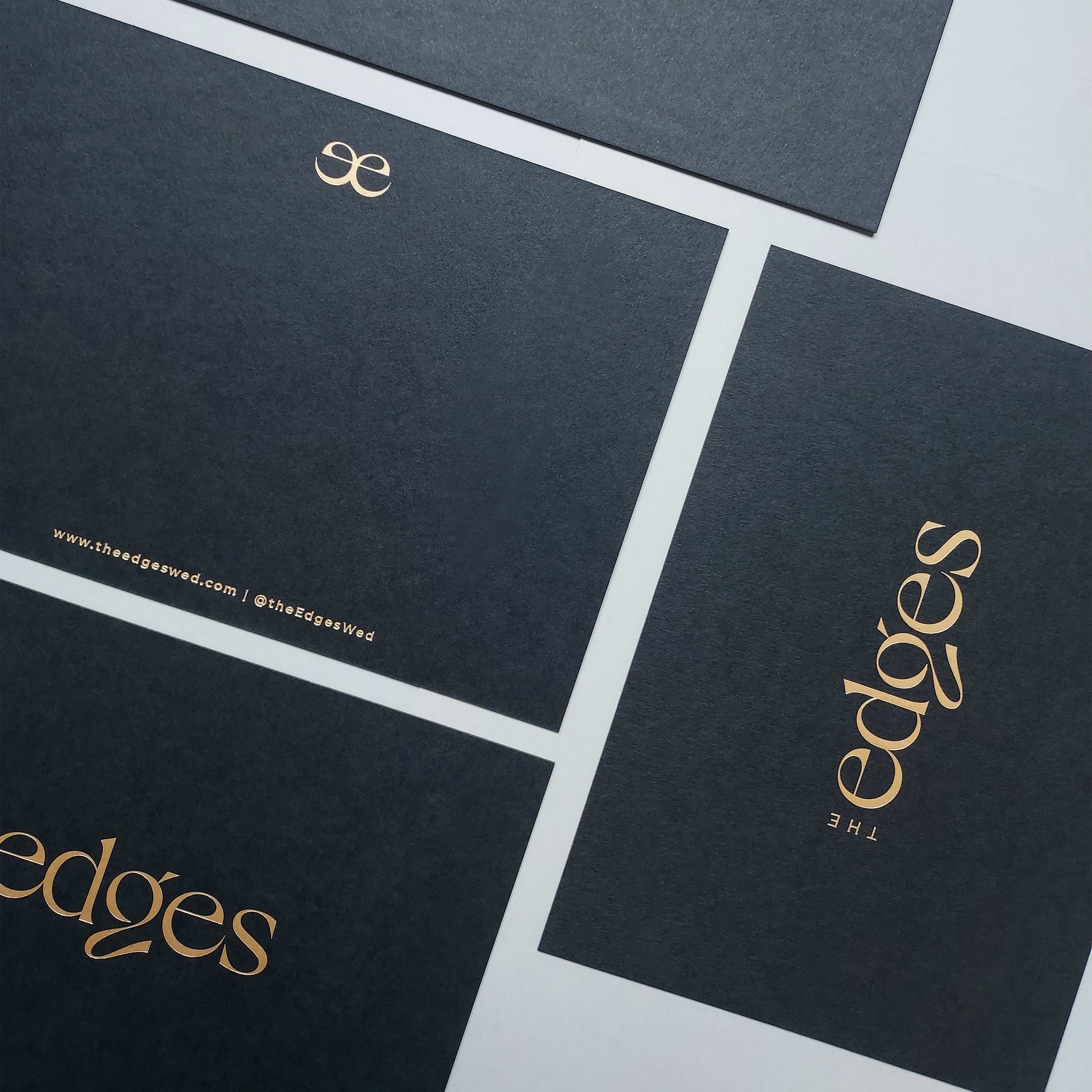 Foil-stamped black postcard on ultra-thick card stock.