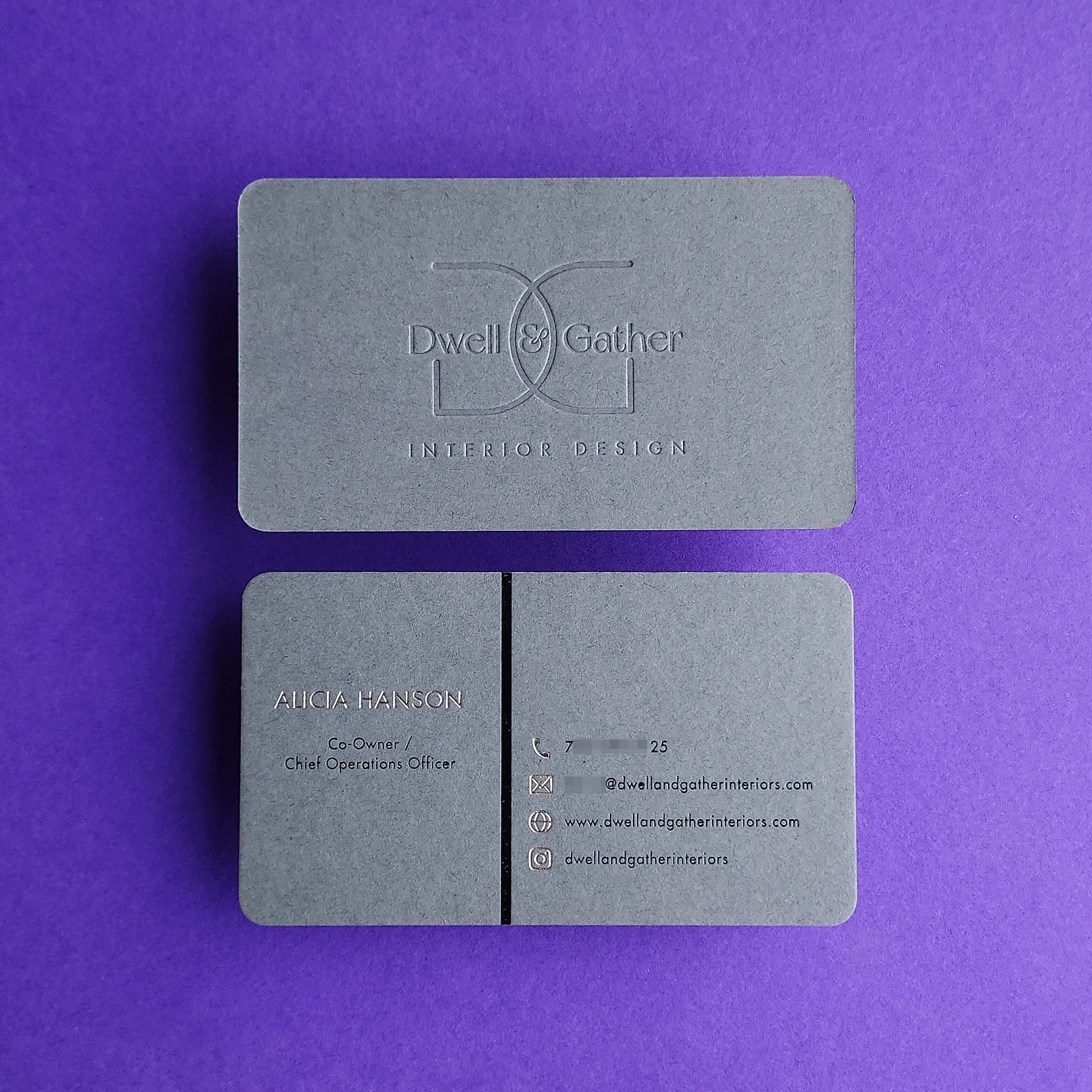 Unique dark grey card with deboss and modern branding appeal.