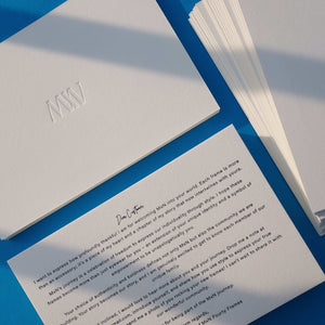 Deep deboss design on premium white cotton postcard