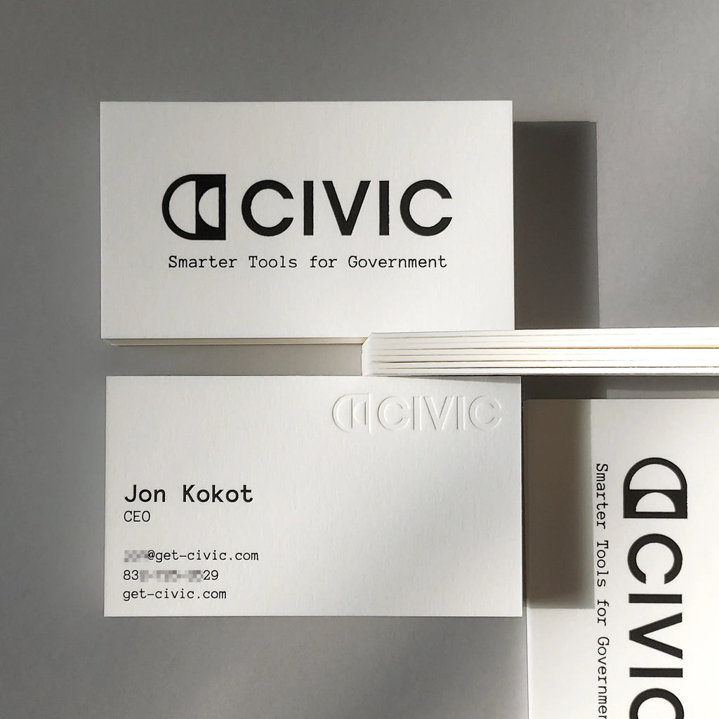 Luxury custom cotton business cards, 45pt thickness, featuring elegant black foil stamping and deep debossing from OddPlanPrint