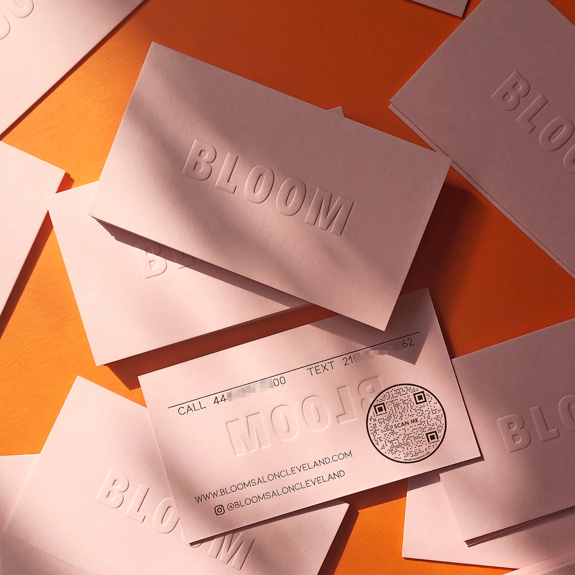 Handcrafted pink card with thick paper and letterpress finish.