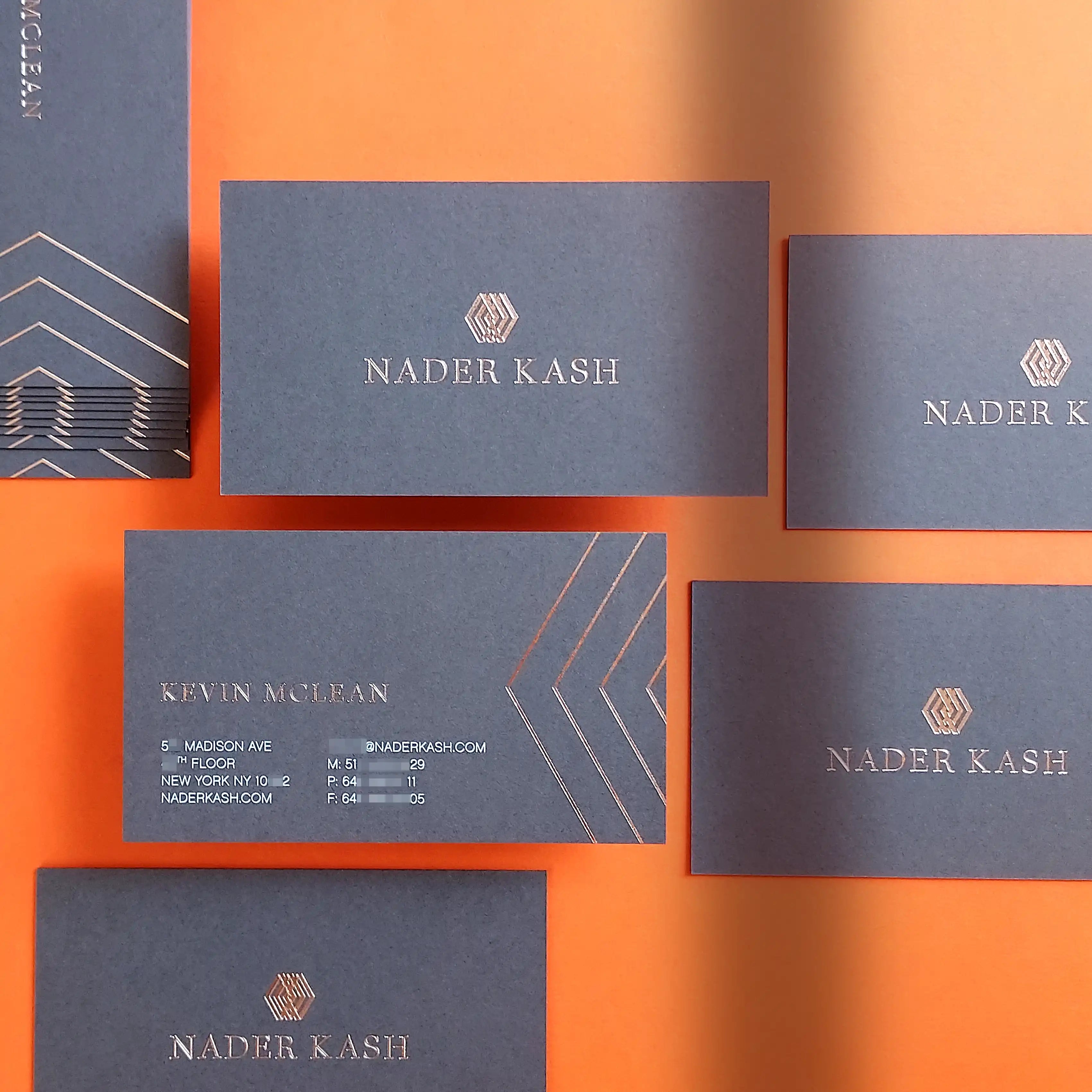 Elegant dark grey business cards with rose gold foil and white printing on heavy 30pt 540gsm card stock by OddPlanPrint.