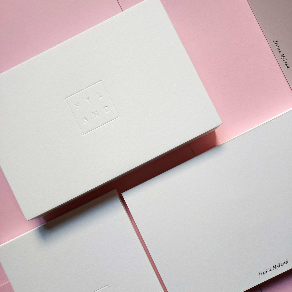 Custom debossed postcard with foil detailing on premium cotton paper