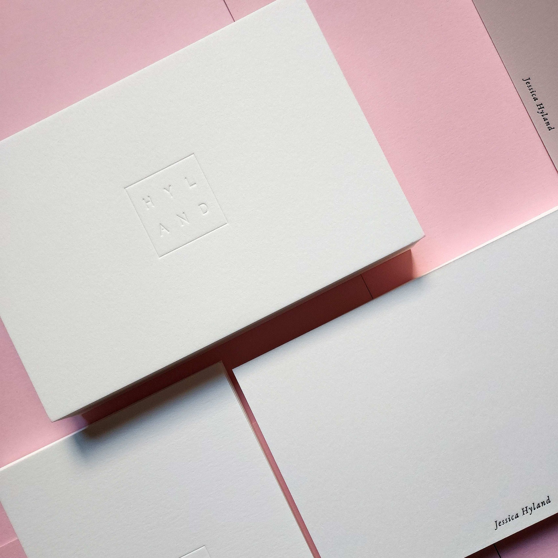 Custom debossed postcard with foil detailing on premium cotton paper