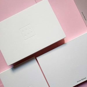 Custom debossed postcard with foil detailing on premium cotton paper