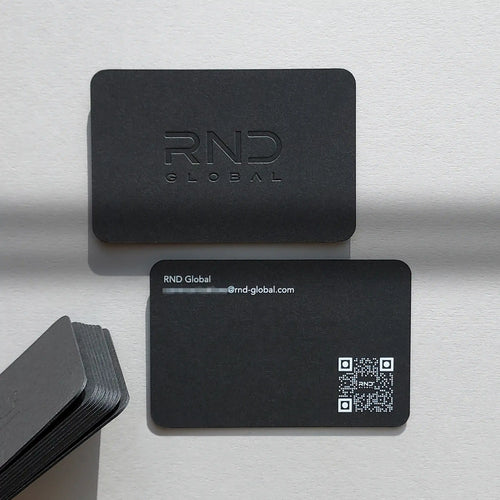 Debossed black business cards 38pt with white printing and rounded corners by OddPlanPrint.