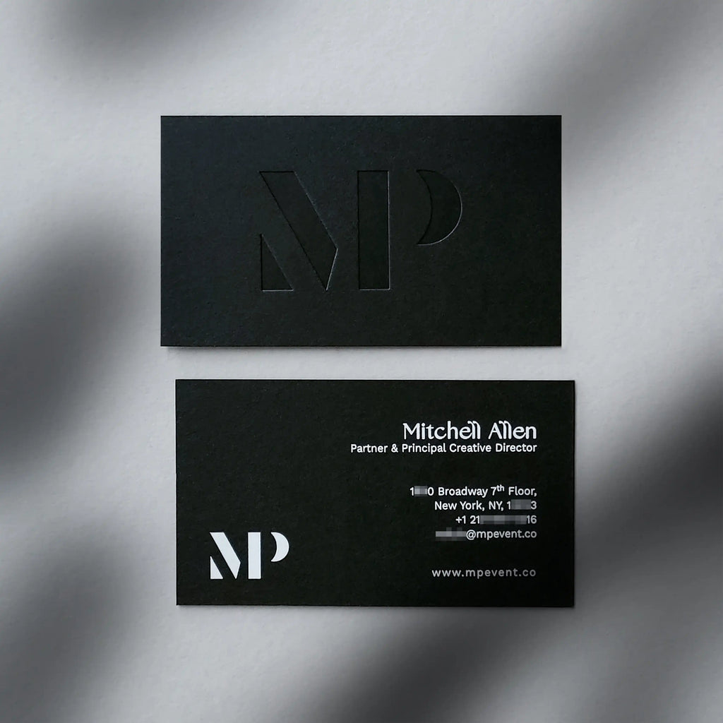 38pt Thick black business cards featuring deboss and white foil accents from OddPlanPrint.