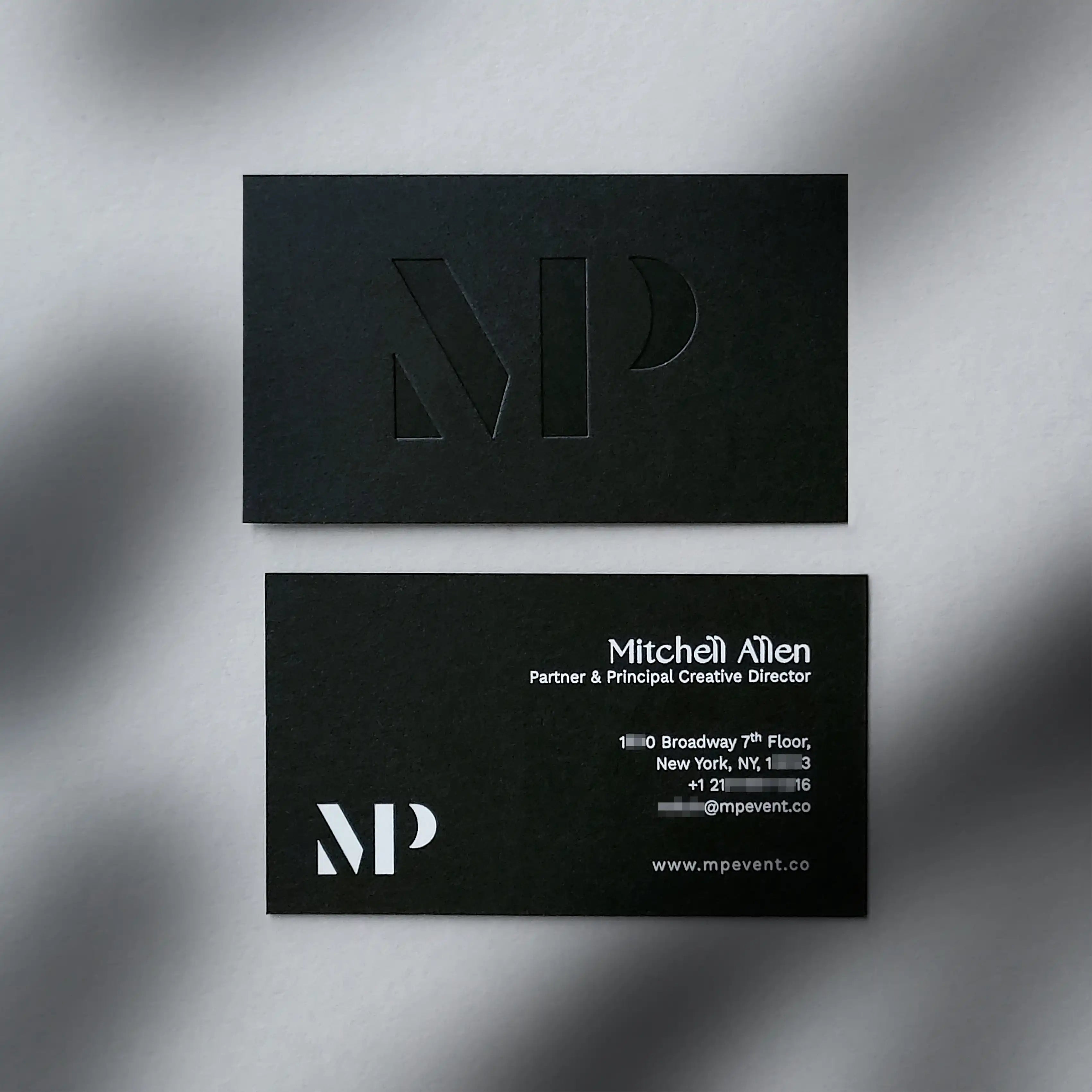 38pt Thick black business cards featuring deboss and white foil accents from OddPlanPrint.