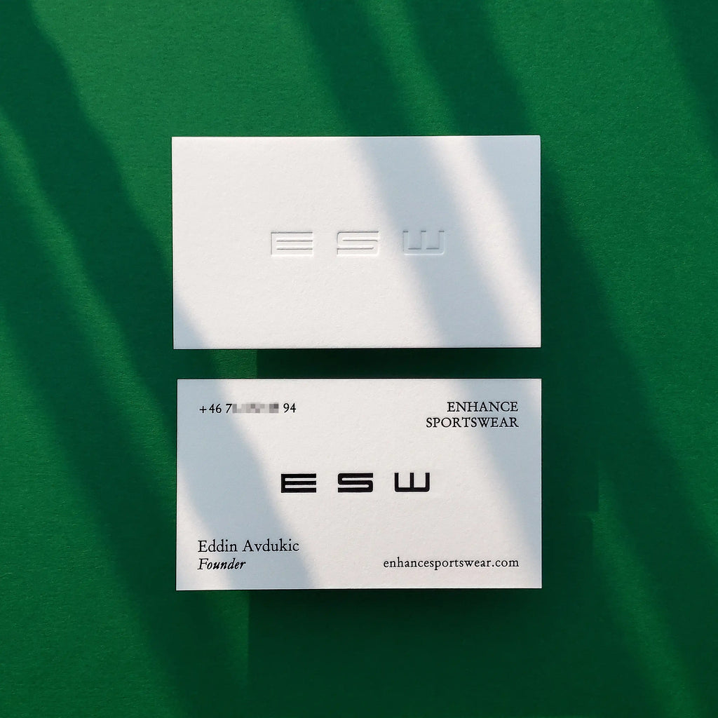 A striking 45pt cotton business card by OddPlanPrint, featuring a deep deboss and bold black foil that creates a high-contrast, tactile look.