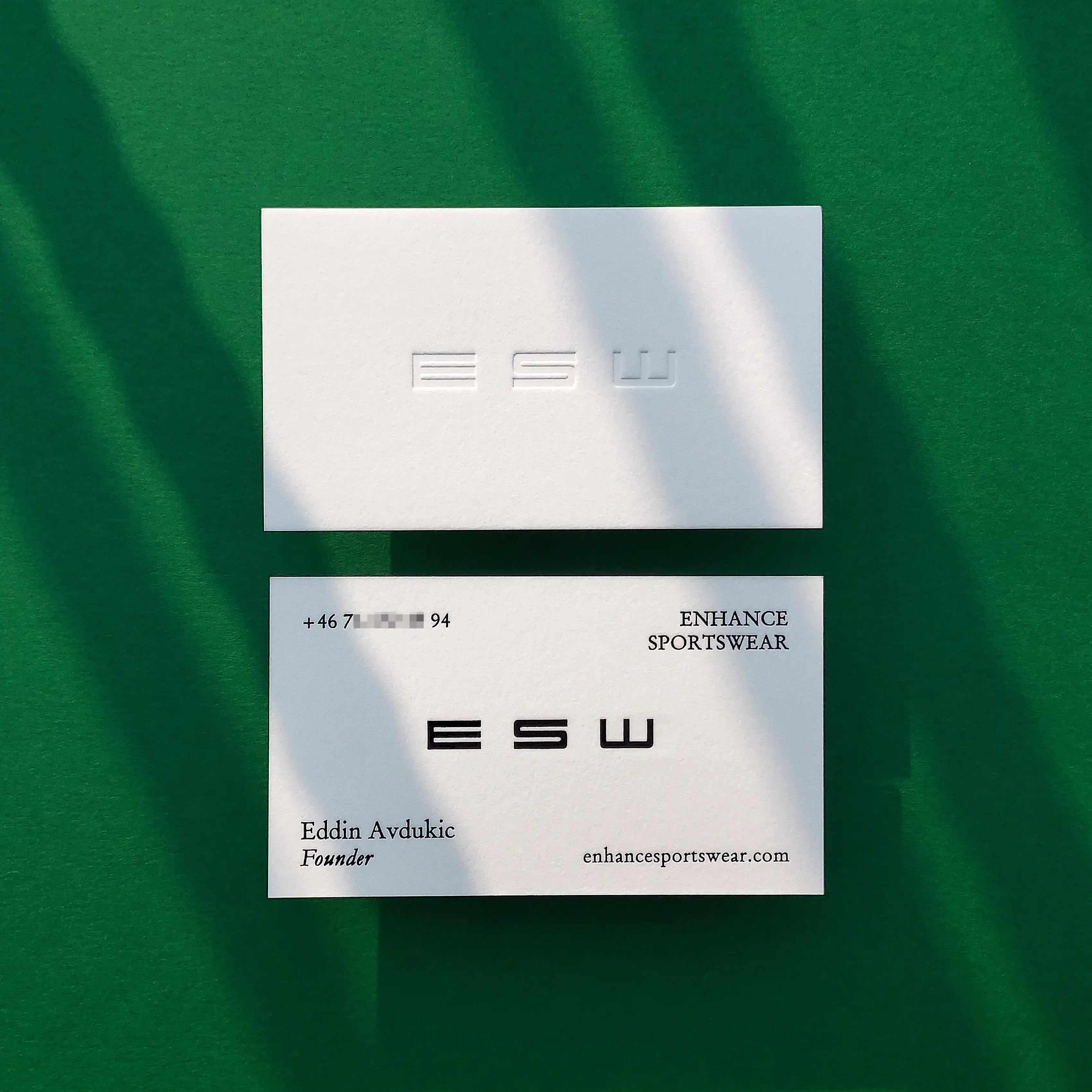 A striking 45pt cotton business card by OddPlanPrint, featuring a deep deboss and bold black foil that creates a high-contrast, tactile look.