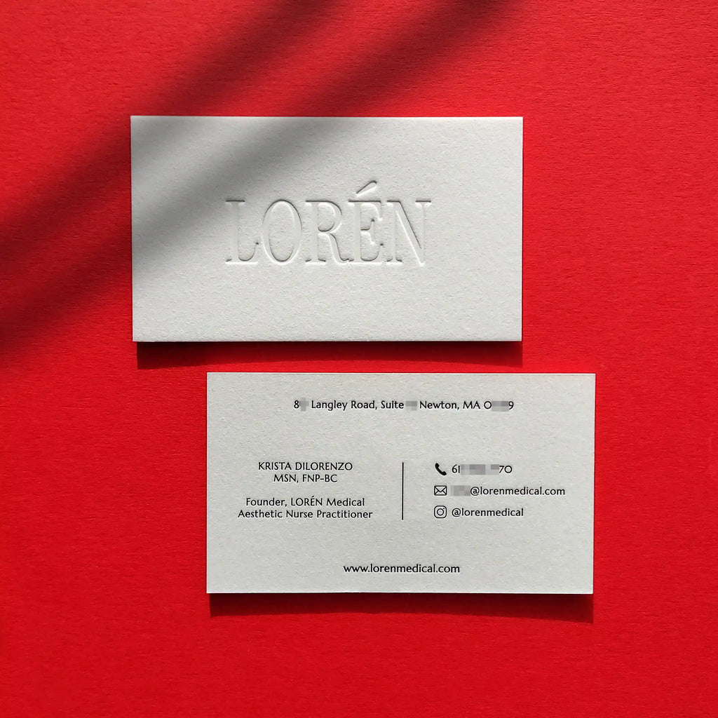 Luxury debossed cotton business cards featuring black glossy foil stamping from OddPlanPrint.