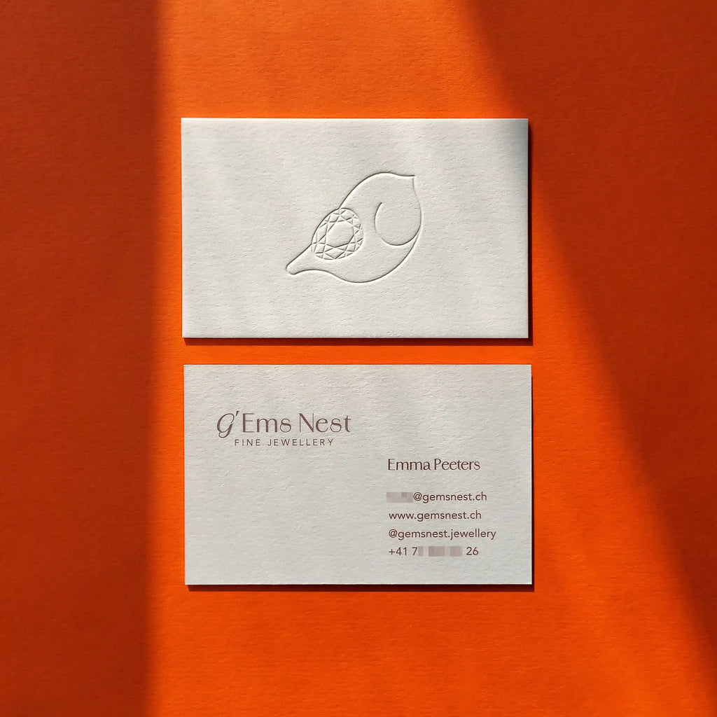 Thick cotton business cards featuring deboss and accurate Pantone printing from OddPlanPrint.