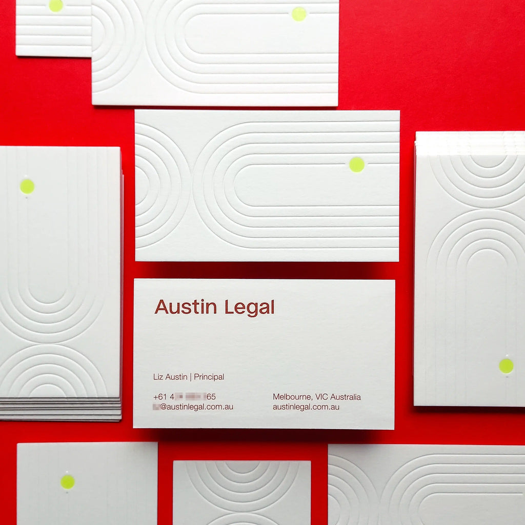 Debossed 45pt cotton business cards with blind deboss, Pantone printing and transparent foil made by OddPlanPrint.