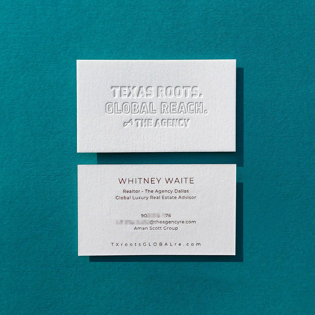Cotton debossed business cards 45pt thick with deboss and glossy red foil finished by OddPlanPrint.