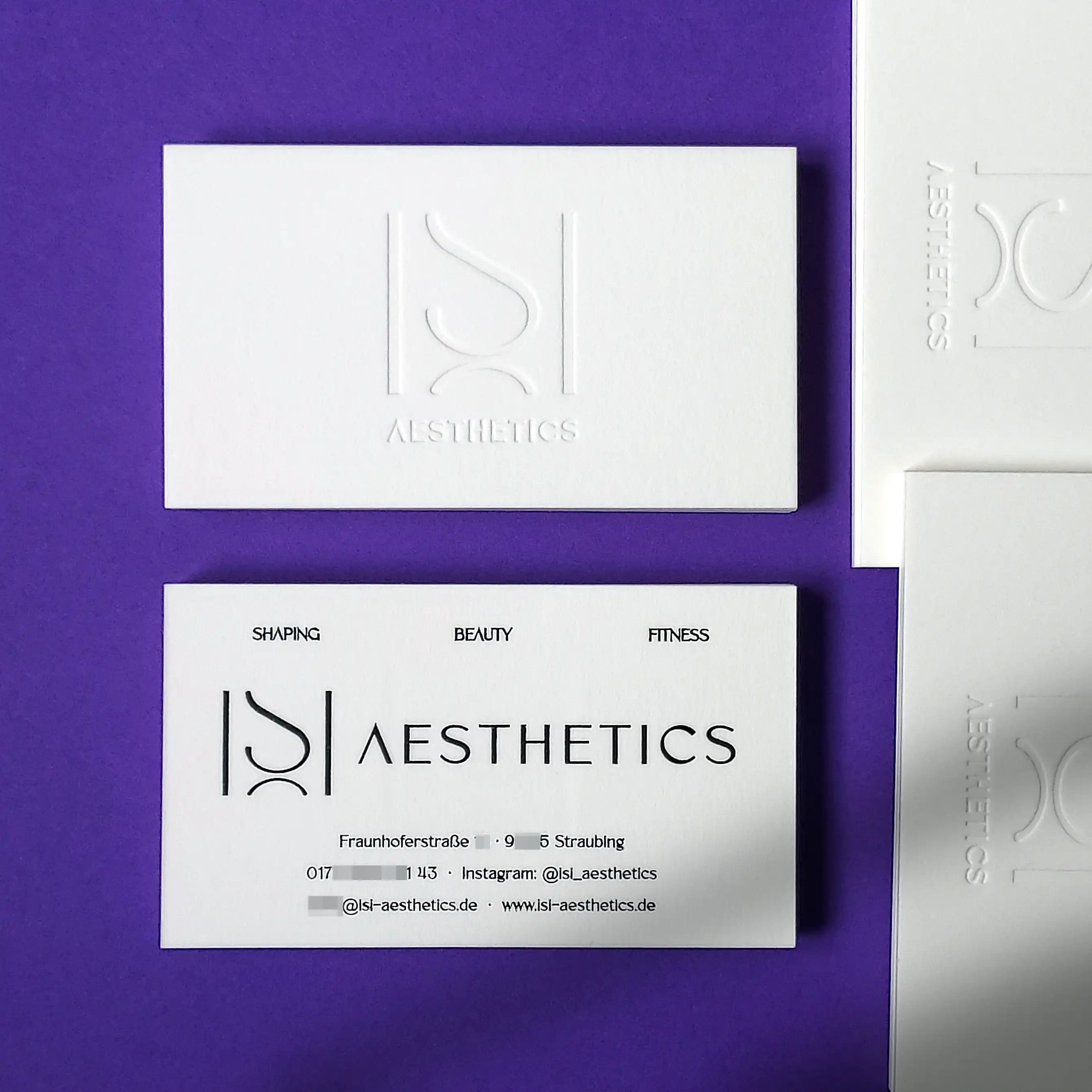 premium cotton business card with debossed logo and glossy black foil lettering | OddPlanPrint