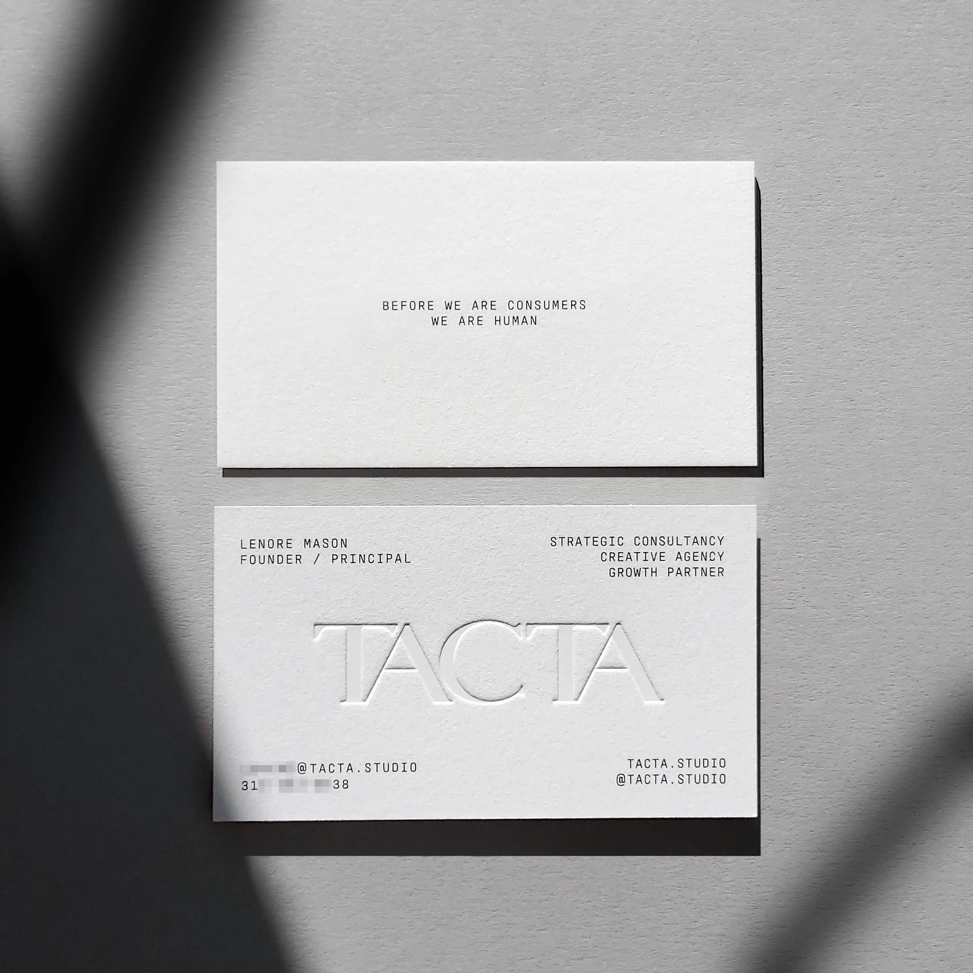 Cotton debossed business cards 45pt with blind deboss and black printing finished by OddPlanPrint.