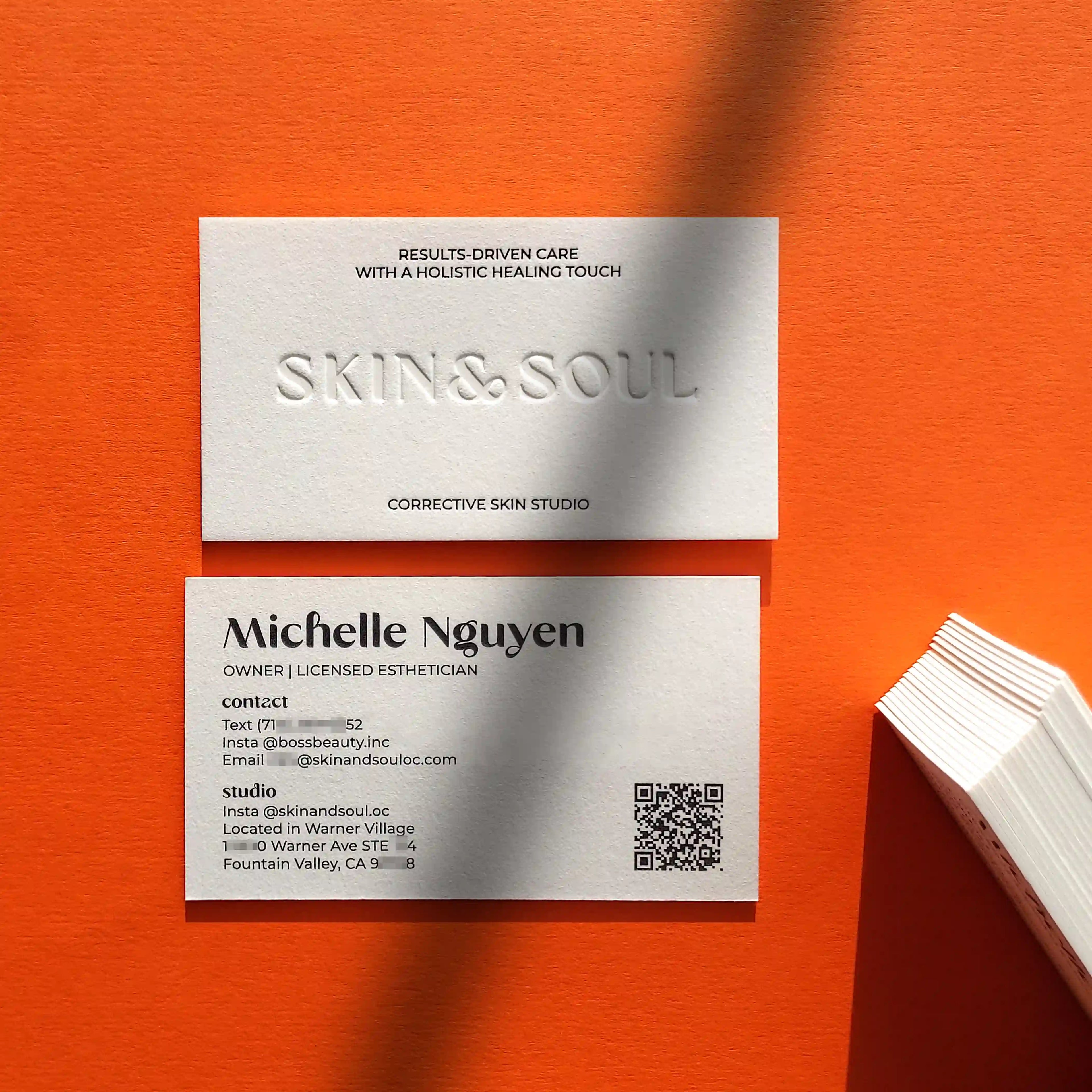 Cotton debossed business cards 45pt with deboss, black foil and black printing made by OddPlanPrint.