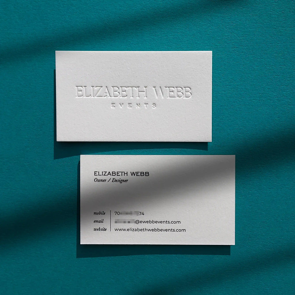 Debossed cotton business cards 45pt thick with black ink foil by OddPlanPrint.