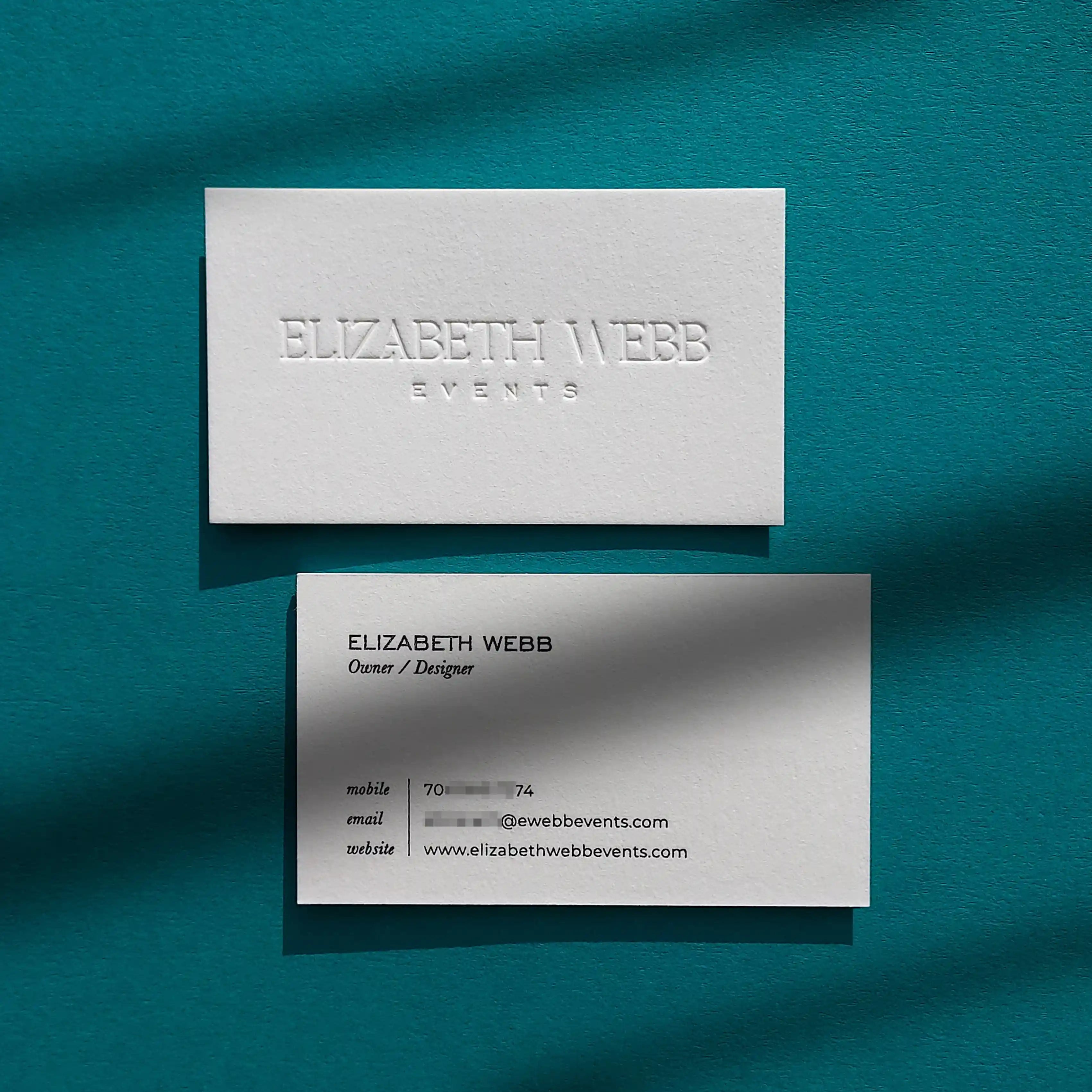 Debossed cotton business cards 45pt thick with black ink foil by OddPlanPrint.